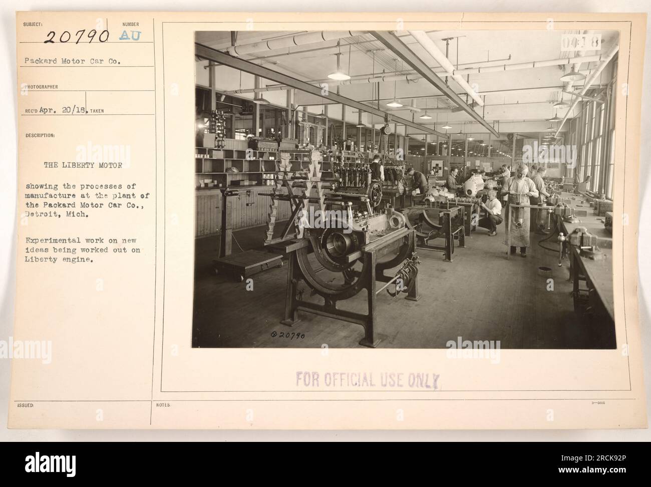 Experimental work on the Liberty motor underway at the Packard Motor Car Co. plant in Detroit, Michigan. The photograph shows the manufacturing processes involved and the testing of new ideas for the engine. An official document, it is marked as 'For Official Use Only.' Stock Photo