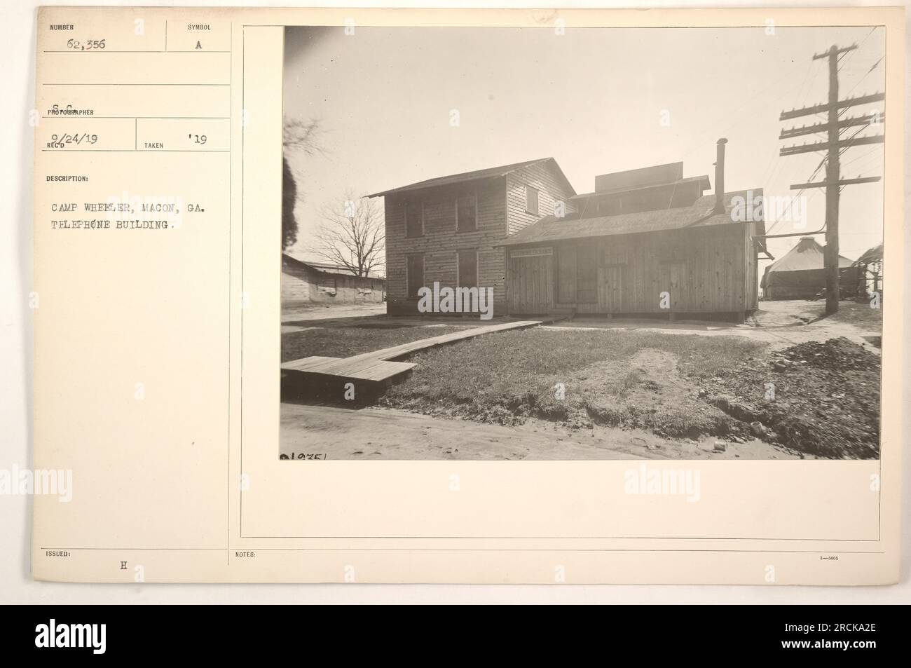 'Telephone Building at Camp Wheeler in Macon, Georgia. Photo taken in 1919. The building was assigned the numerical designation of 62,556, according to official records. The image shows a symbol 'H' on the building. Note: Information provided is descriptive and factual.' Stock Photo