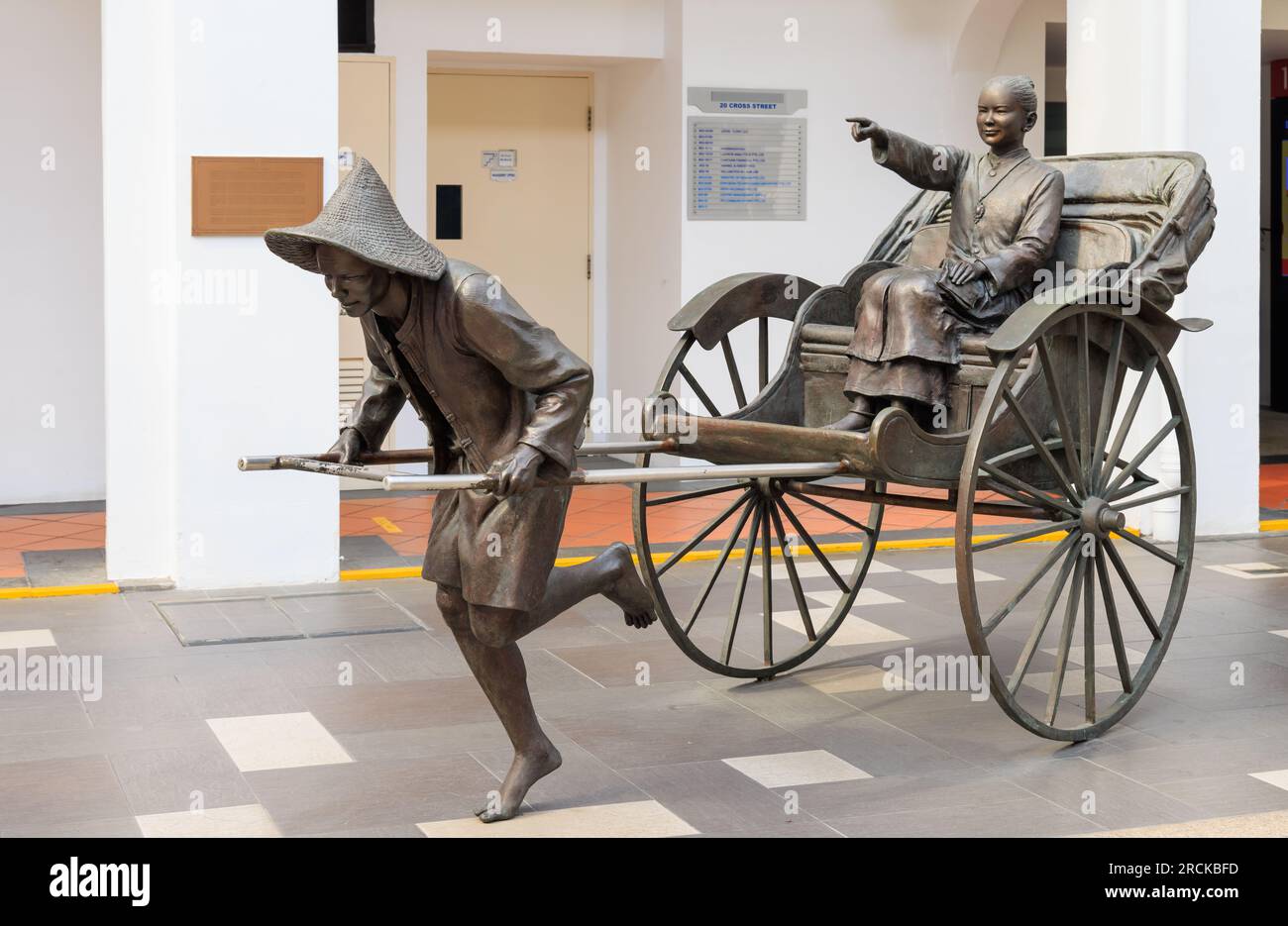 'Heading Home' bronze statue by Lim Leong Seng outside China Square Central, Singapore Stock Photo