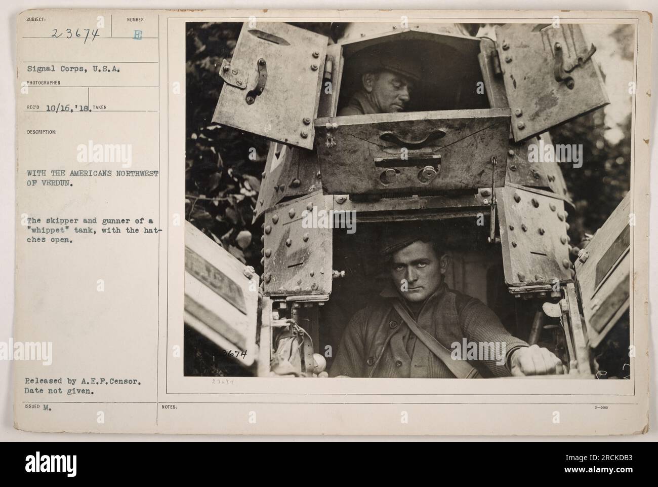 'American tank crew members operating a 'whippet' tank during World War I. The skipper and gunner are shown with their hatch open. The photograph was taken northwestern of Verdun. Date of the photograph is unknown. Released by A.E.F. Censor. SSD M. NOTES.' Stock Photo