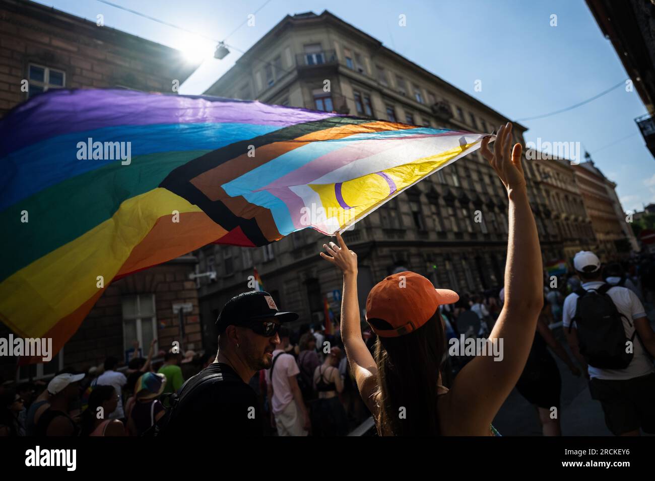 Budapest, Hungary. 15th July, 2023. People take part in the Pride parade in Budapest. For the past two years, Hungary has had a so-called 'child protection law' that falsely equates homosexuality with pedophilia. The law prohibits providing young people with information about homosexuality, transsexuality or gender reassignment. Credit: Marton Monus/dpa/Alamy Live News Stock Photo