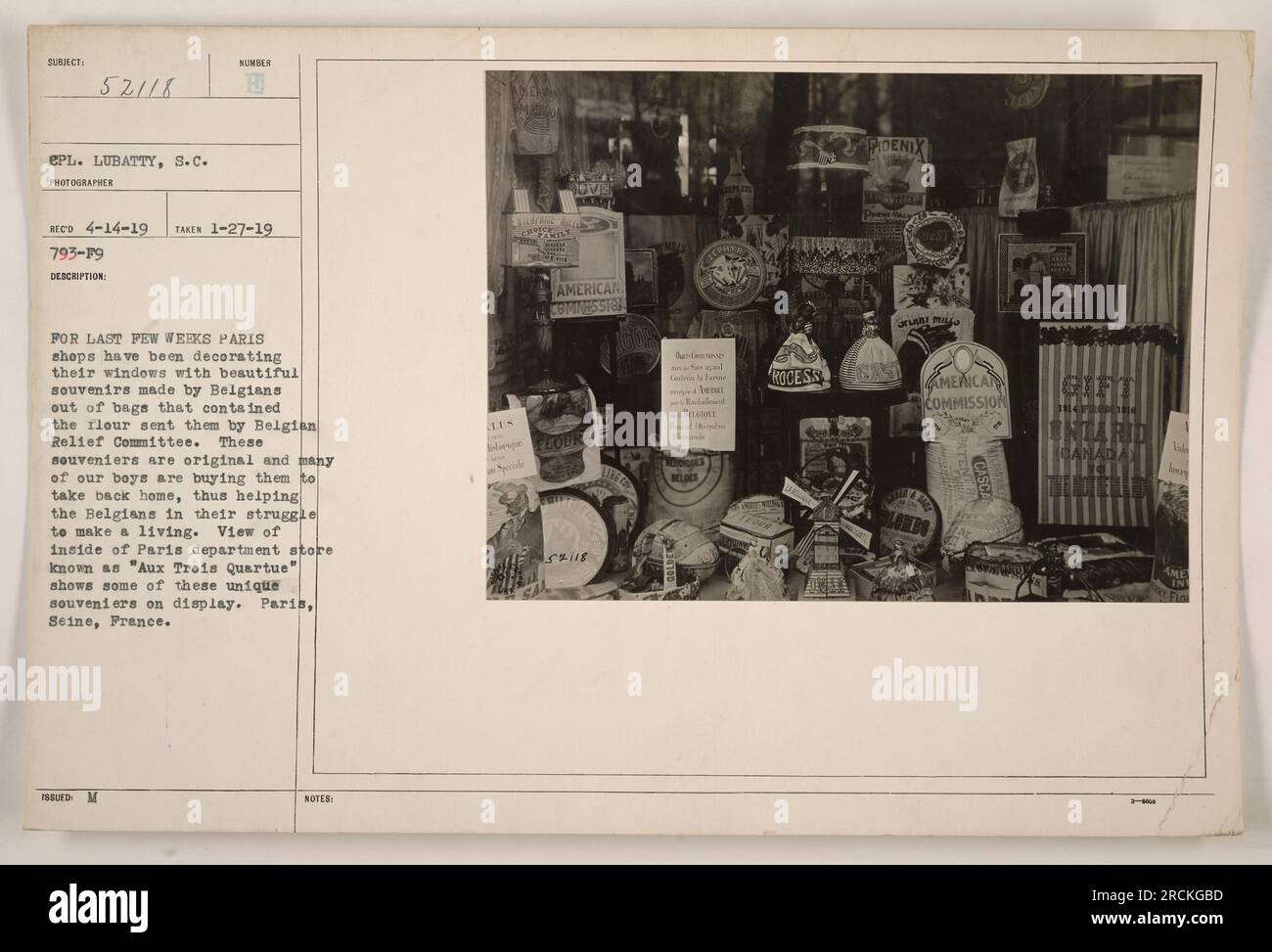 Inside view of Paris department store, 'Aux Trois Quartue,' showcasing unique souvenirs made by Belgians out of bags that contained flour sent to them by the Belgian Relief Committee. These souvenirs, purchased by American soldiers to support the Belgians' struggle to make a living, are on display. (Caption is 50 words) Stock Photo