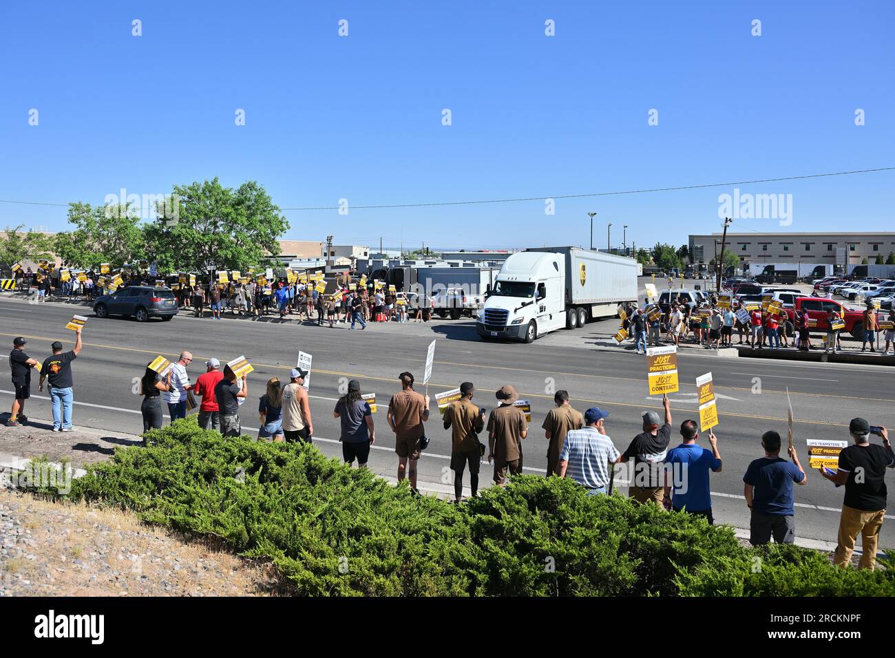 Albuquerque, United States. 15th July, 2023. A UPS semi truck leaves the UPS Customer Center as members of the Teamsters Local 492 practice picket on July 15, 2023 in Albuquerque, New Mexico. Labor talks between UPS and its unionized drivers and warehouse workers broke down on July 5. The workers' current contract expires July 31 (Photo by Sam Wasson/Sipa USA) Credit: Sipa USA/Alamy Live News Stock Photo