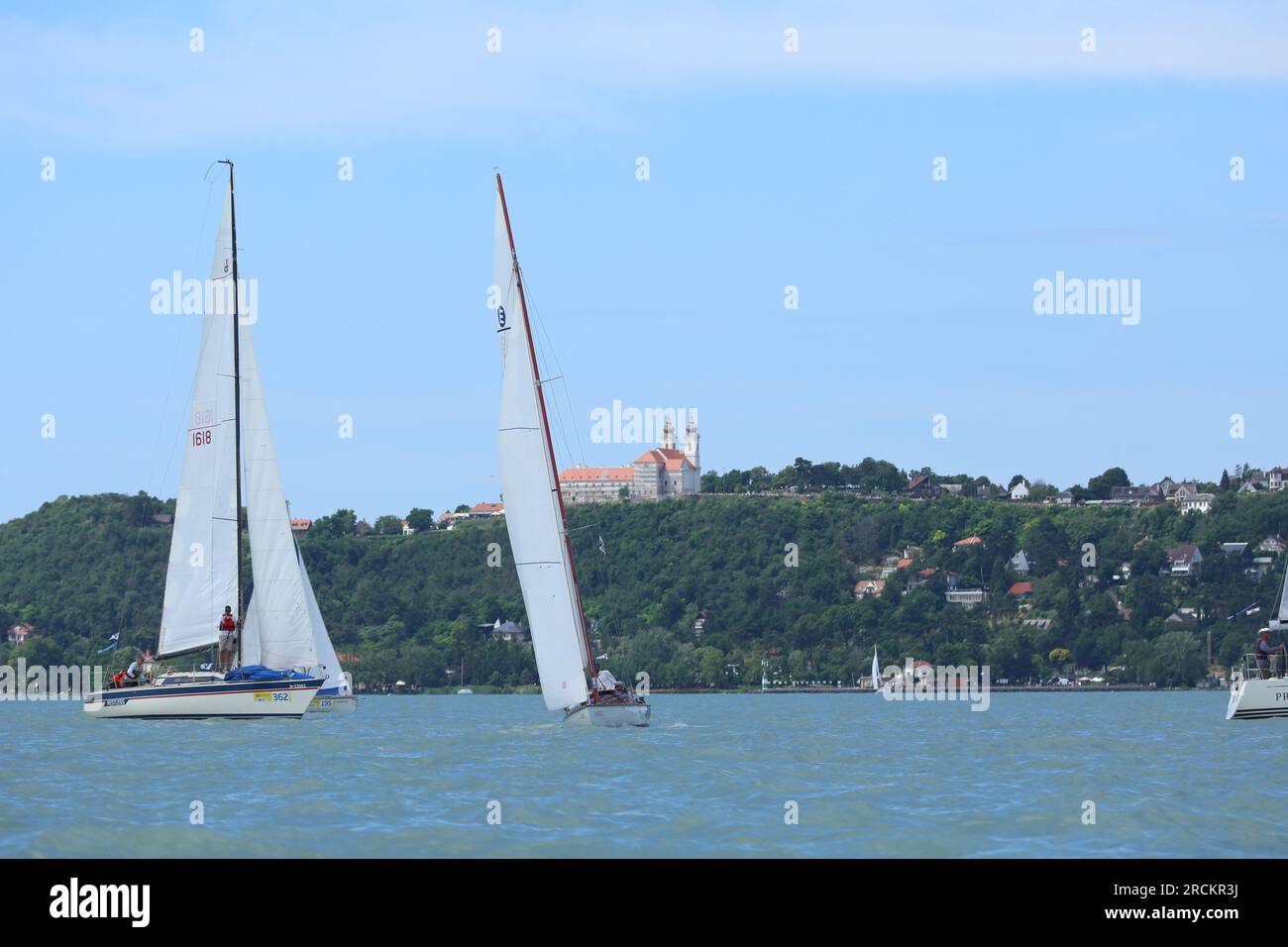 Lake of Balaton, Hungary Europe. 06 July 2023: Group of sailboats sail in  windy weather in the turquoise waters of the Lake Balaton Plattensee during  Stock Photo - Alamy