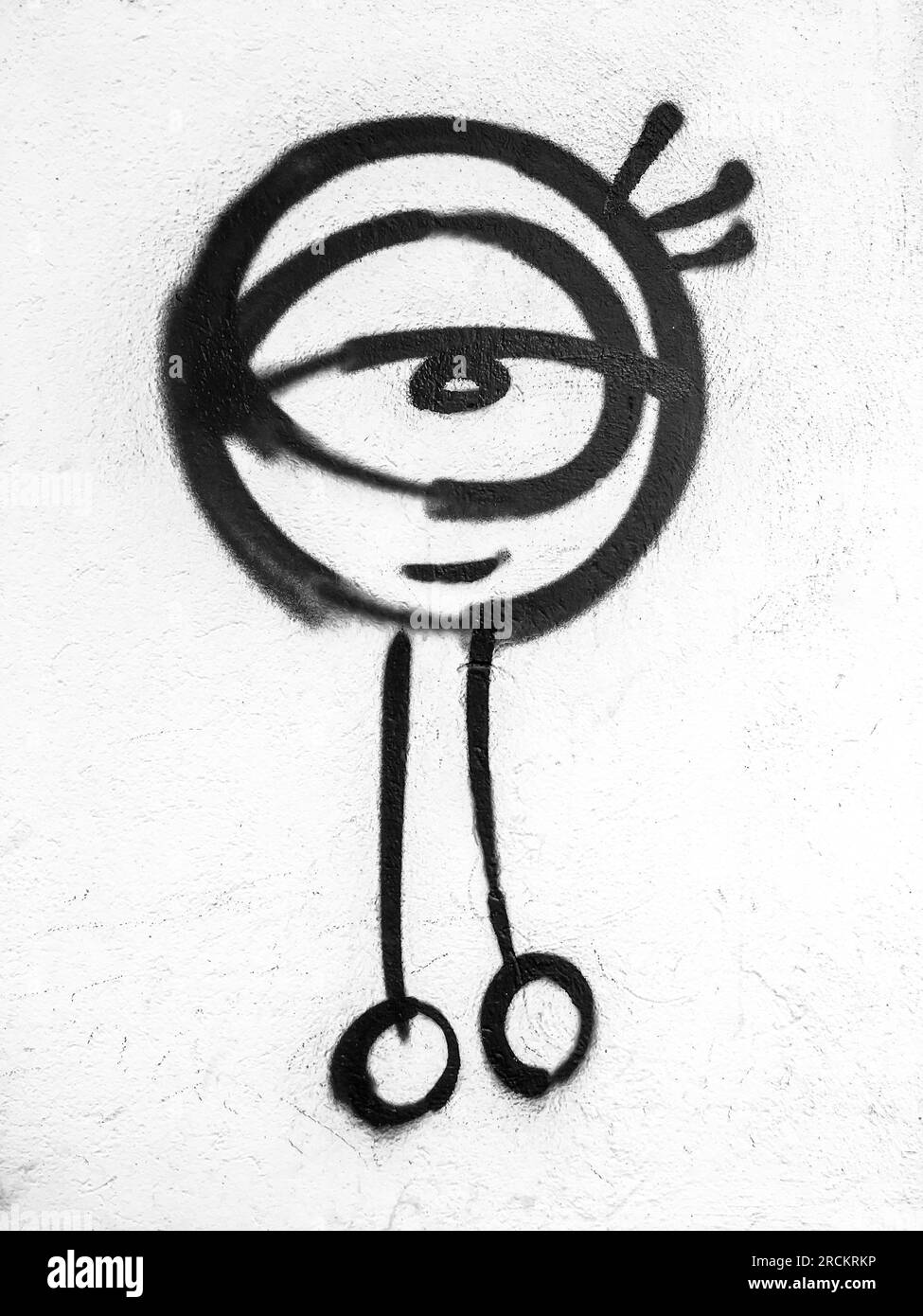 Graffiti on a white exterior wall depicting an alien. Art. Fantasy. Science. Concepts. Stock Photo