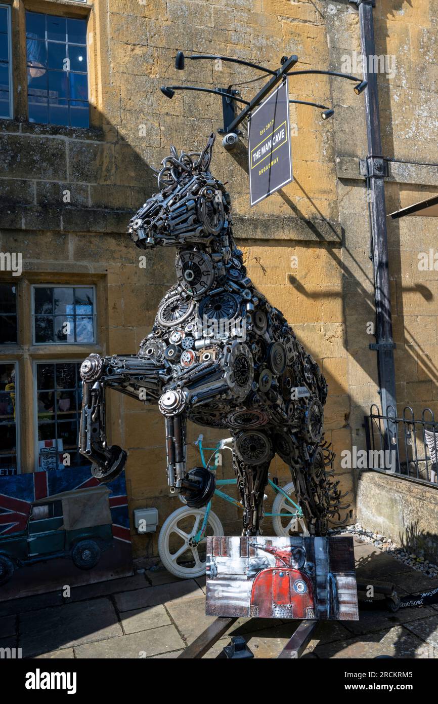 Sculpture at the entrance to The Man Cave, High Street, Broadway, Cotswolds, Worcestershire, England, UK Stock Photo