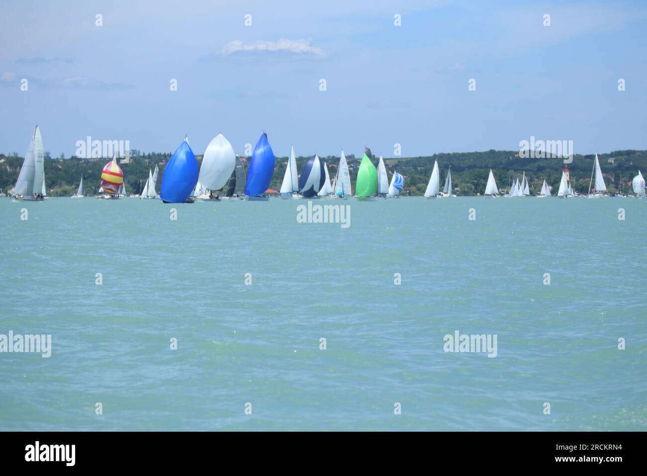 Lake of Balaton, Hungary Europe. 06 July 2023: Group of sailboats sail in  windy weather in the turquoise waters of the Lake Balaton Plattensee during  Stock Photo - Alamy