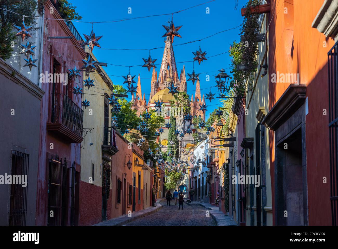 Mexican tin stars strung across the the cobblestone Calle Aldama with