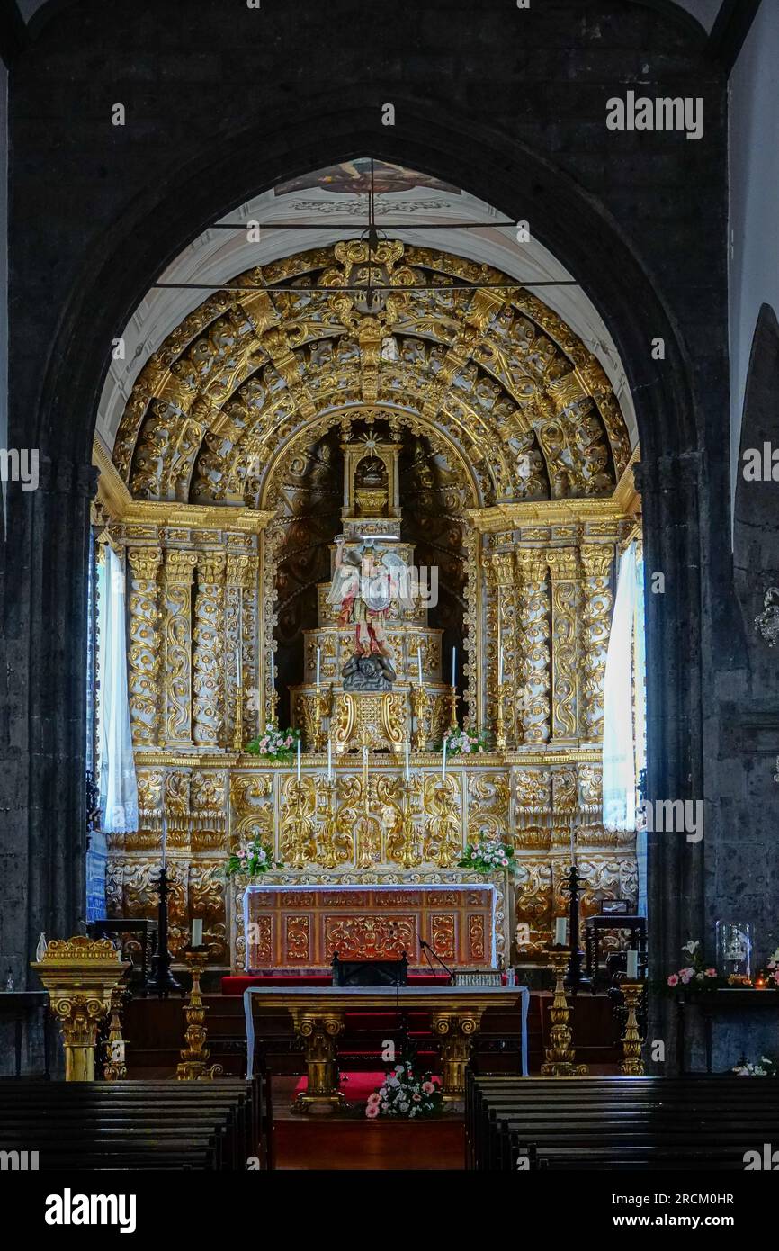Interior view of the 16th century Igreja de São Miguel Arcanjo and altar in the historic village of Vila Franca do Campo in Sao Miguel Island, Azores, Portugal. The village was established in the middle of the 15th century by Gonçalo Vaz Botelho. Stock Photo