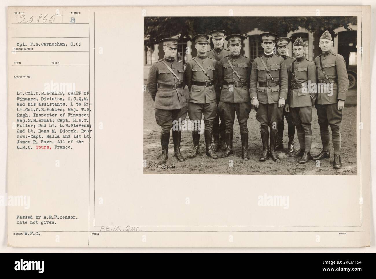 Caption: 'Cpl. F.G. Carnochan, S. C., in a group photo with Lt. Col. C.B. Eckles, Chief of Finance, Division, O.C.Q.M., and his assistants. Left to right: Lt. Col. C.B. Eckles; Maj. T.S. Rugh, Inspector of Finance; Maj.S.B. Armat; Capt. H.B.T. Fuller; 2nd Lt. L. R. Stevens; 2nd Lt. Hans M. Bjorck. Rear row: Capt. Halla and 1st Lt. James R. Page. All members of the Q.M.C, stationed in Tours, France during World War One.' Stock Photo