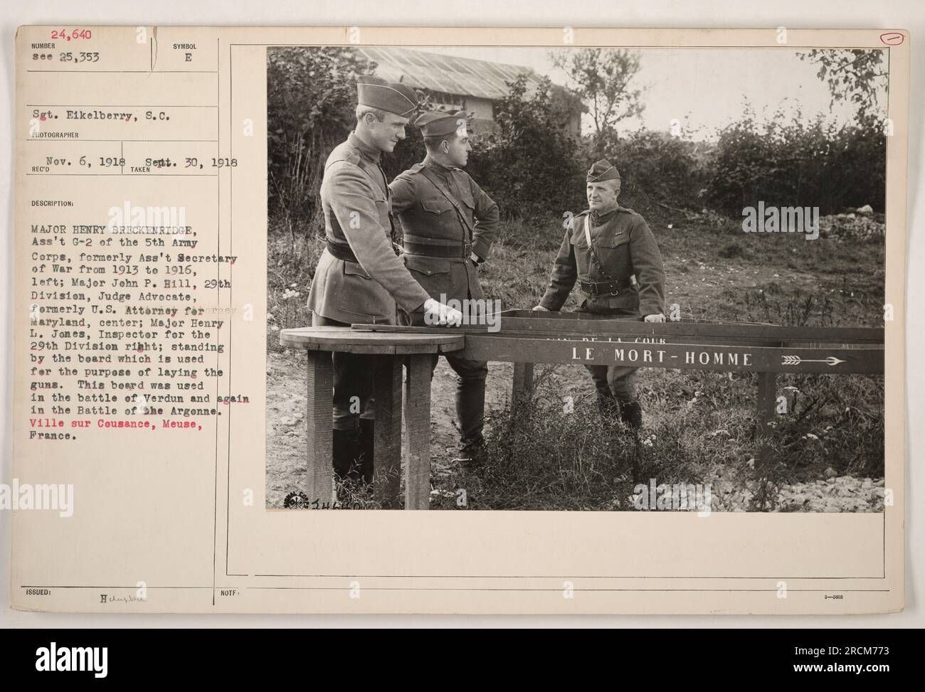 Major Henry Breckenridge, formerly Ass't Secretary of War, Major John P. Hill, U.S. Attorney, and Major Henry L. Jones, Inspector for the 29th Division, stand by a board used for laying guns. The board was used in the battles of Verdun and the Argonne. Ville sur Cousance, Meuse, France. Stock Photo