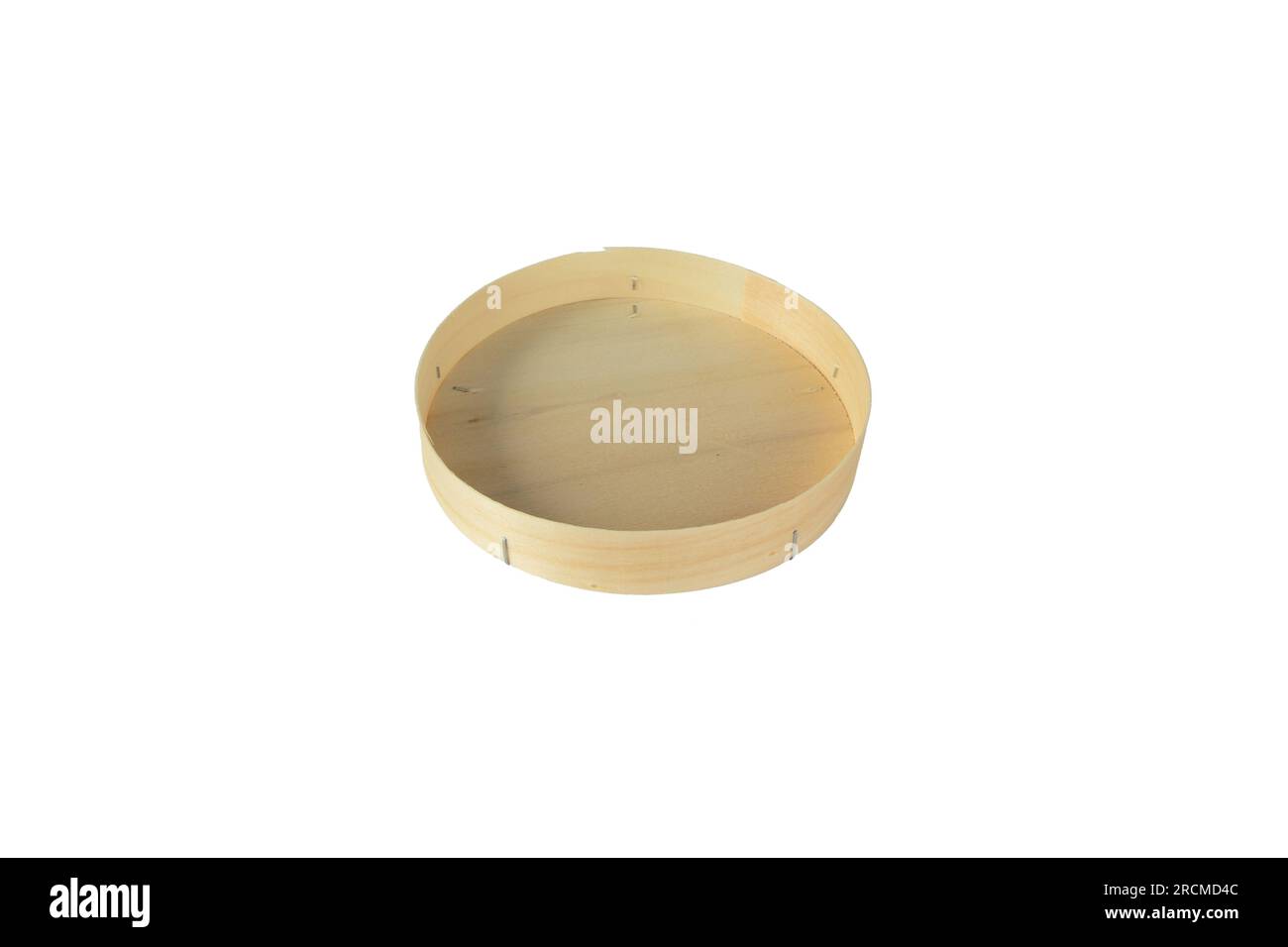 Wooden round opened low cheese box isolated on white. Empty food container. Stock Photo