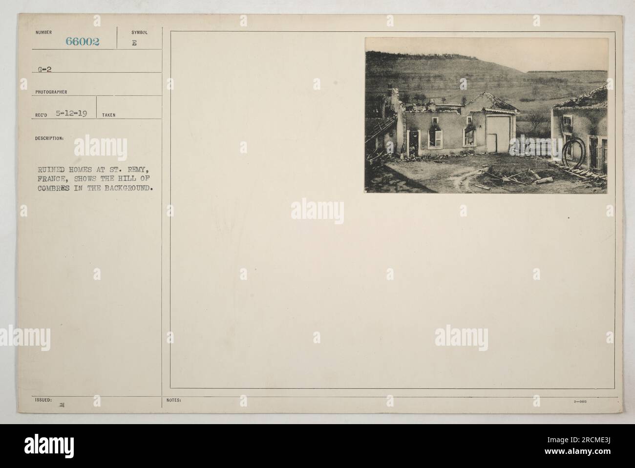 Ruined houses in St. Remy, France, with the hill of Combres visible in ...