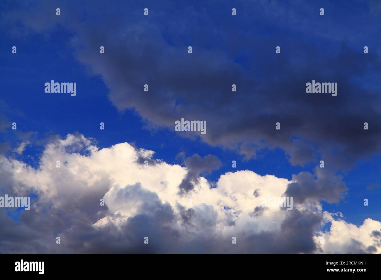 Dark, white, grey cloud, clouds, blue sky, skies, weather, meteorology. Stock Photo