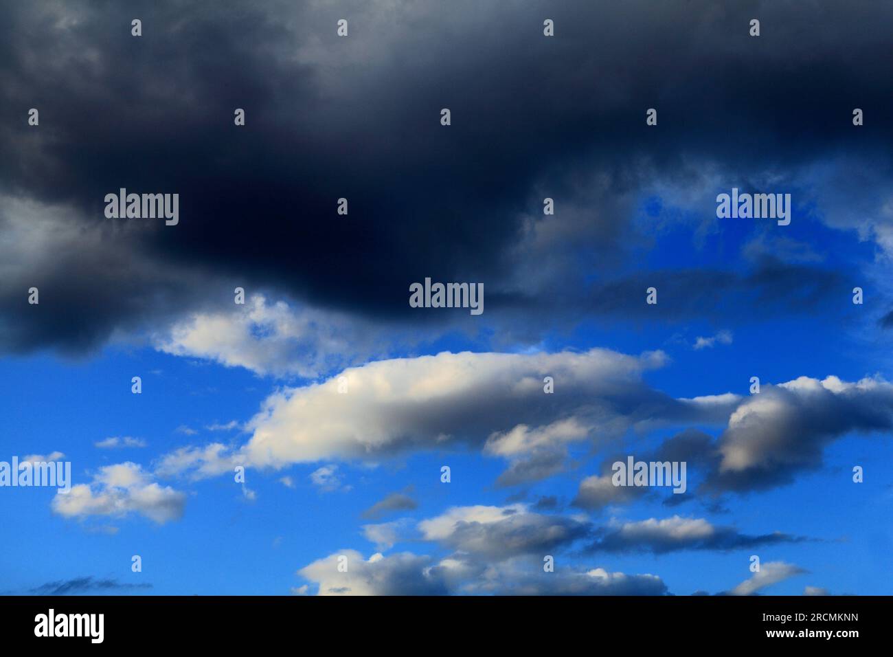 Dark, white, grey cloud, clouds, blue sky, skies, weather, meteorology. Stock Photo