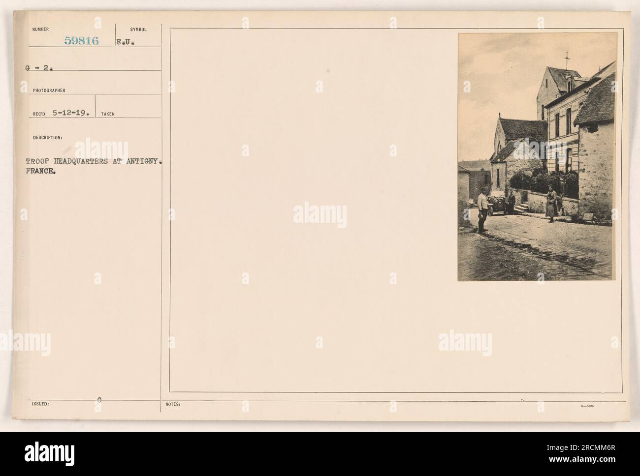 Troop headquarters at Antigny, France during World War One. This photograph was taken on May 12, 1919, by photographer RECO. The identification number is 59816 B.U. The image shows a symbol issued for troop headquarters at Antigny, France. Additional notes indicate TL 3 as the tagline for this image. Stock Photo