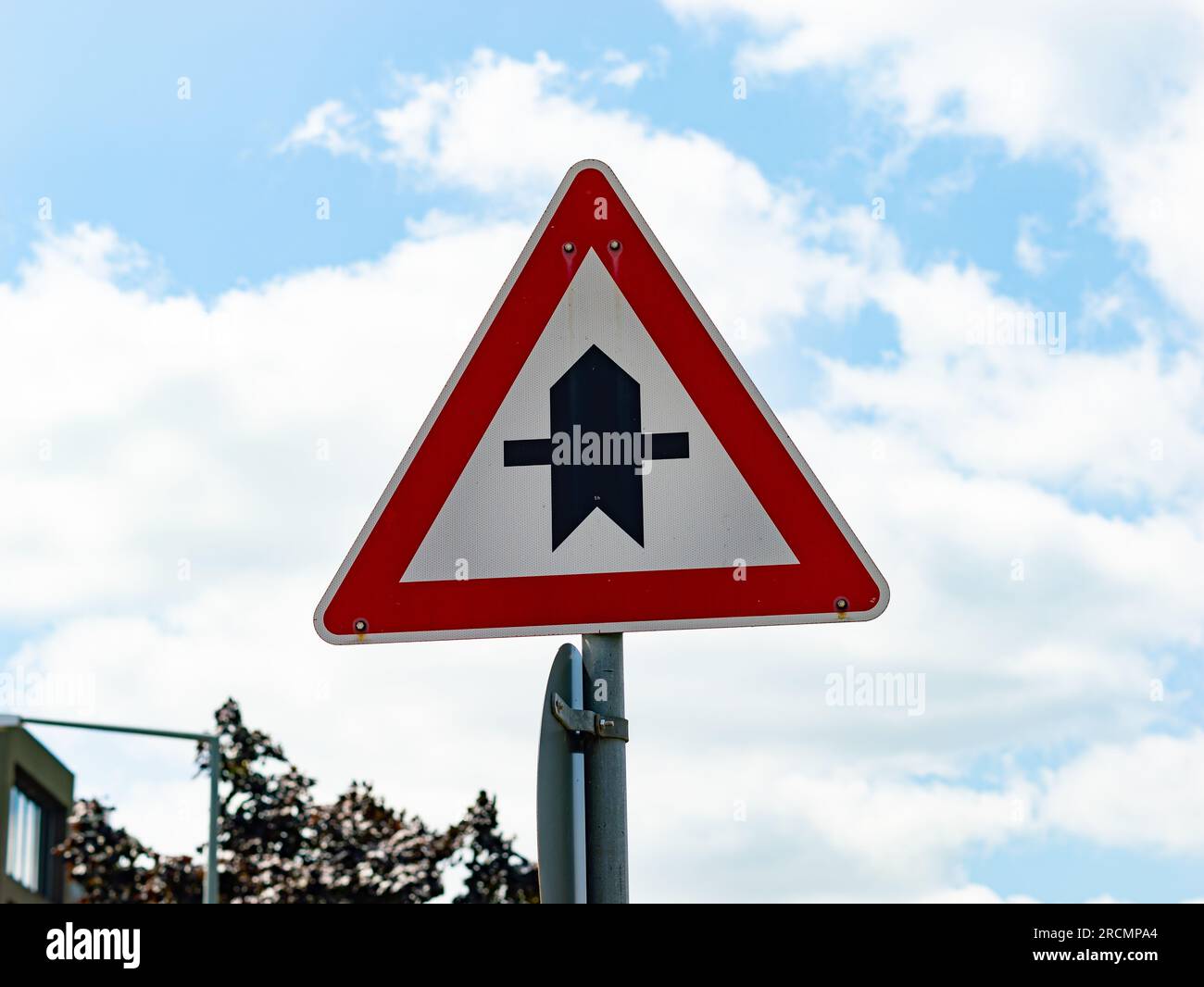 Right of way traffic sign next to a street in Germany. The symbol tells the user that this road