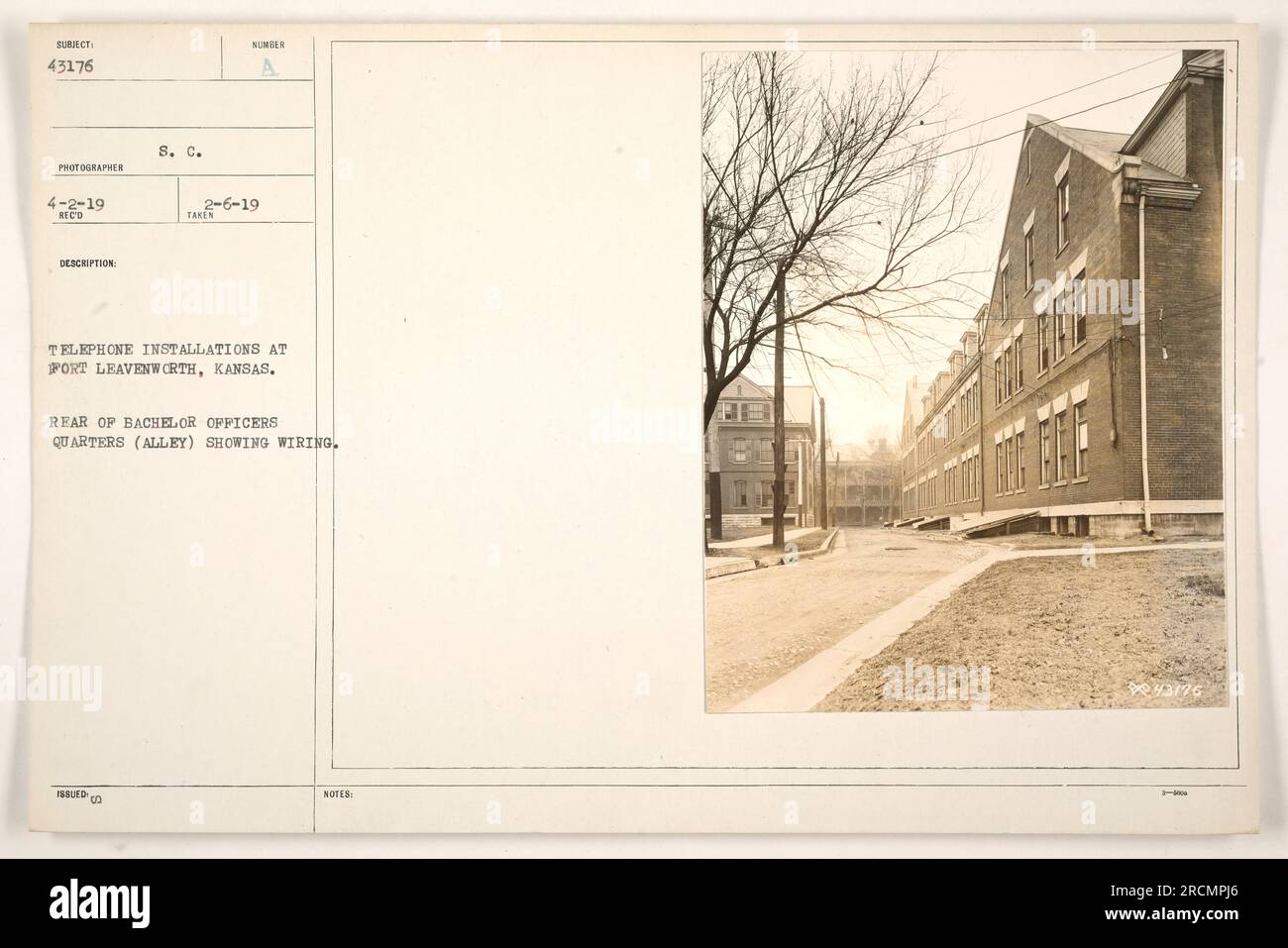 The photograph depicts the rear of Bachelor Officers Quarters at Fort