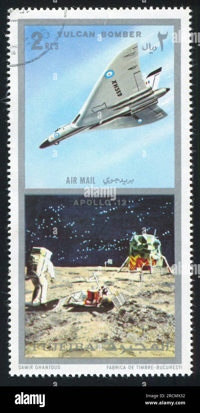 FUJEIRA - CIRCA 1985: stamp printed by Fujeira, shows Vulcan Bomber and Apollo 12, circa 1985 Stock Photo