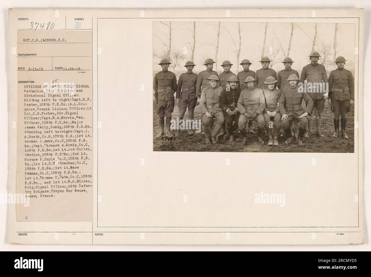 This is a photograph taken on November 22, 1918, featuring the officers of the 109th Field Signal Battalion, 33rd Division, and Divisional Signal Officer. The individuals in the photo are identified, along with their respective positions and units. The location is Treyon Sur Meuse, Heuse, France. The photograph is labeled with the registration number 37450. Stock Photo