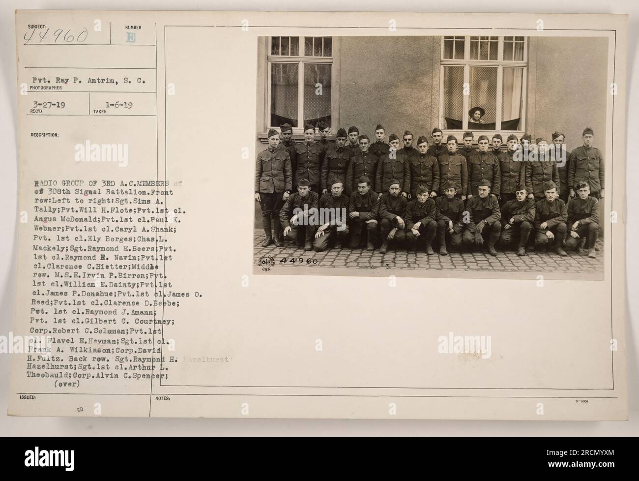 Members of the 308th Signal Battalion pose for a group photo. Taken on January 6, 1919, the image includes various ranks and names of the soldiers. Front row (left to right): Sgt. Sims A. Tally, Pvt. Will H. Flote, Pvt. 1st Cl. Angus McDonald, Pvt. 1st Cl. Paul K. Webner, Pvt. 1st Cl. Caryl A. Shank, Pvt. 1st Cl. Ely Borges, Chas. L. Mackely, Sgt. Raymond E. Beers, Pvt. 1st Cl. Raymond R. Navin, Pvt. 1st Cl. Clarence C. Hietter. Middle row: M.S.E. Irvin P. Birron, Pvt. 1st Cl. William E. Dainty, Pvt. 1st Cl. James P. Donahue, Pvt. 1st Cl. James O. Reed, Pvt. 1st Cl. Clarence D. Bebbe, Pvt. 1st Stock Photo