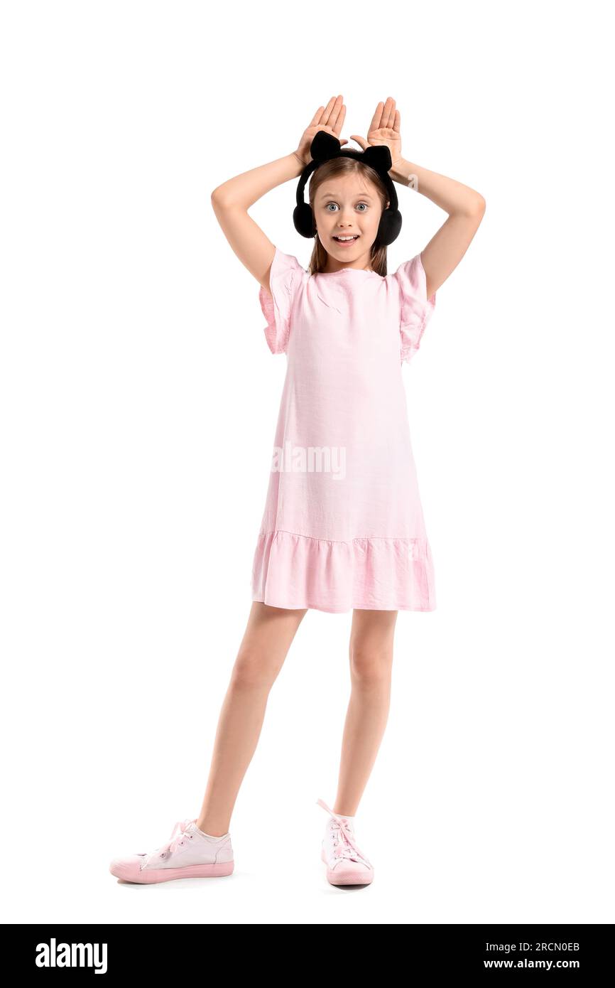 Little girl in cute headphones on white background Stock Photo - Alamy
