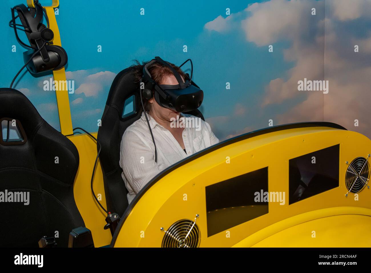 Atchison, Kansas. Amelia Earhart hangar museum. A woman enjoying the virtual reality flight to