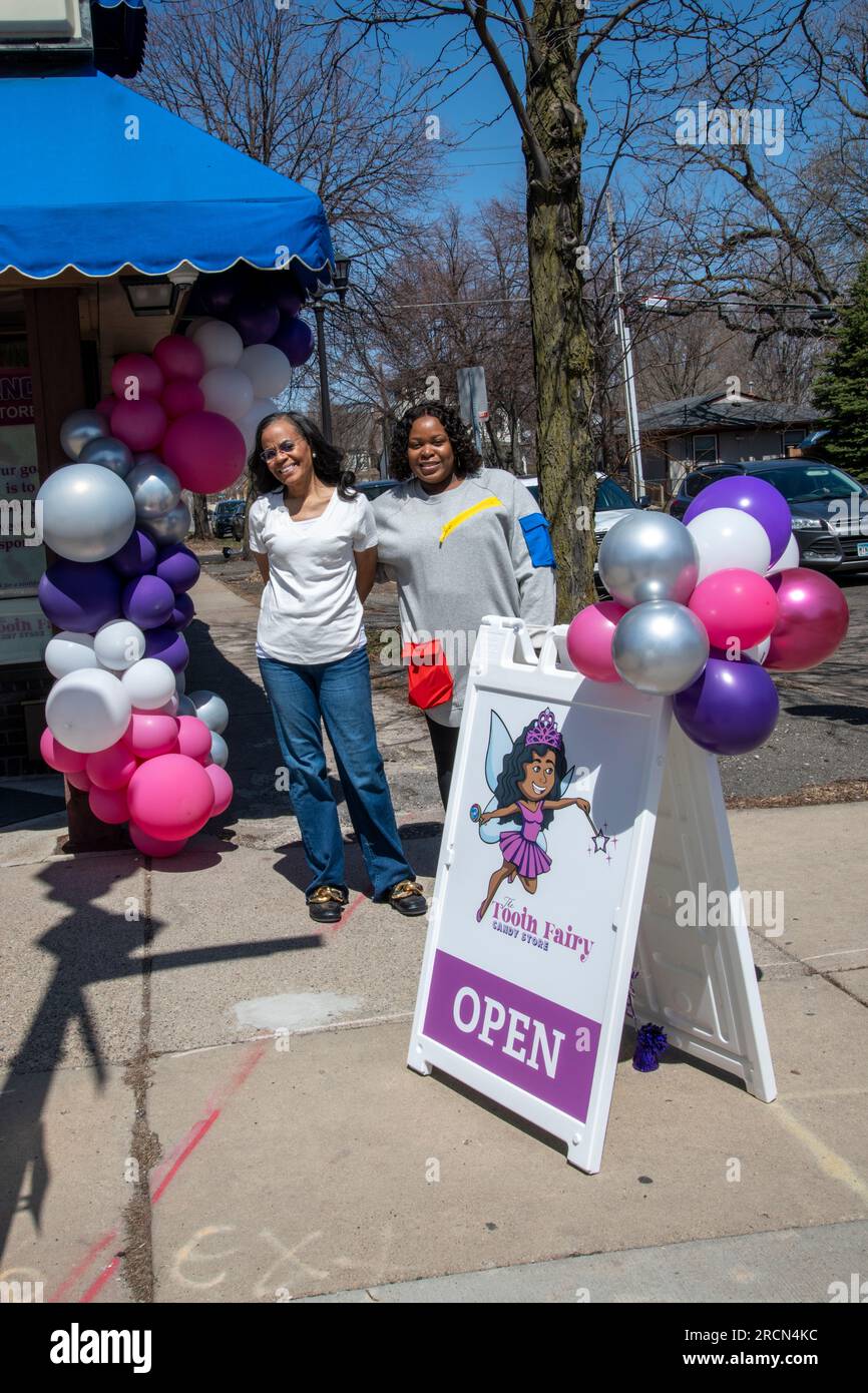 St. Paul, Minnesota. Grand opening of the black owned Tooth Fairy candy store. The owner stands outside the store on opening day and says Its mission Stock Photo
