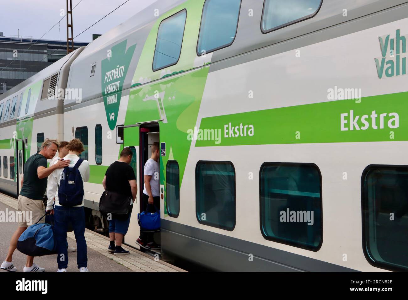 Saying goodbye and boarding long-distance business class compartment at Helsinki main railroad station summer 2023 Stock Photo