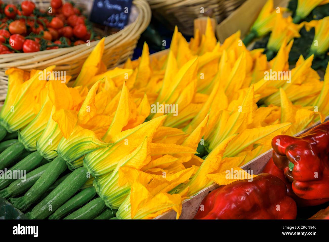 Traditional delicacy from South of France, courgette or zucchini flowers at a local provencal farmers market in Vieil Antibes, South of France Stock Photo