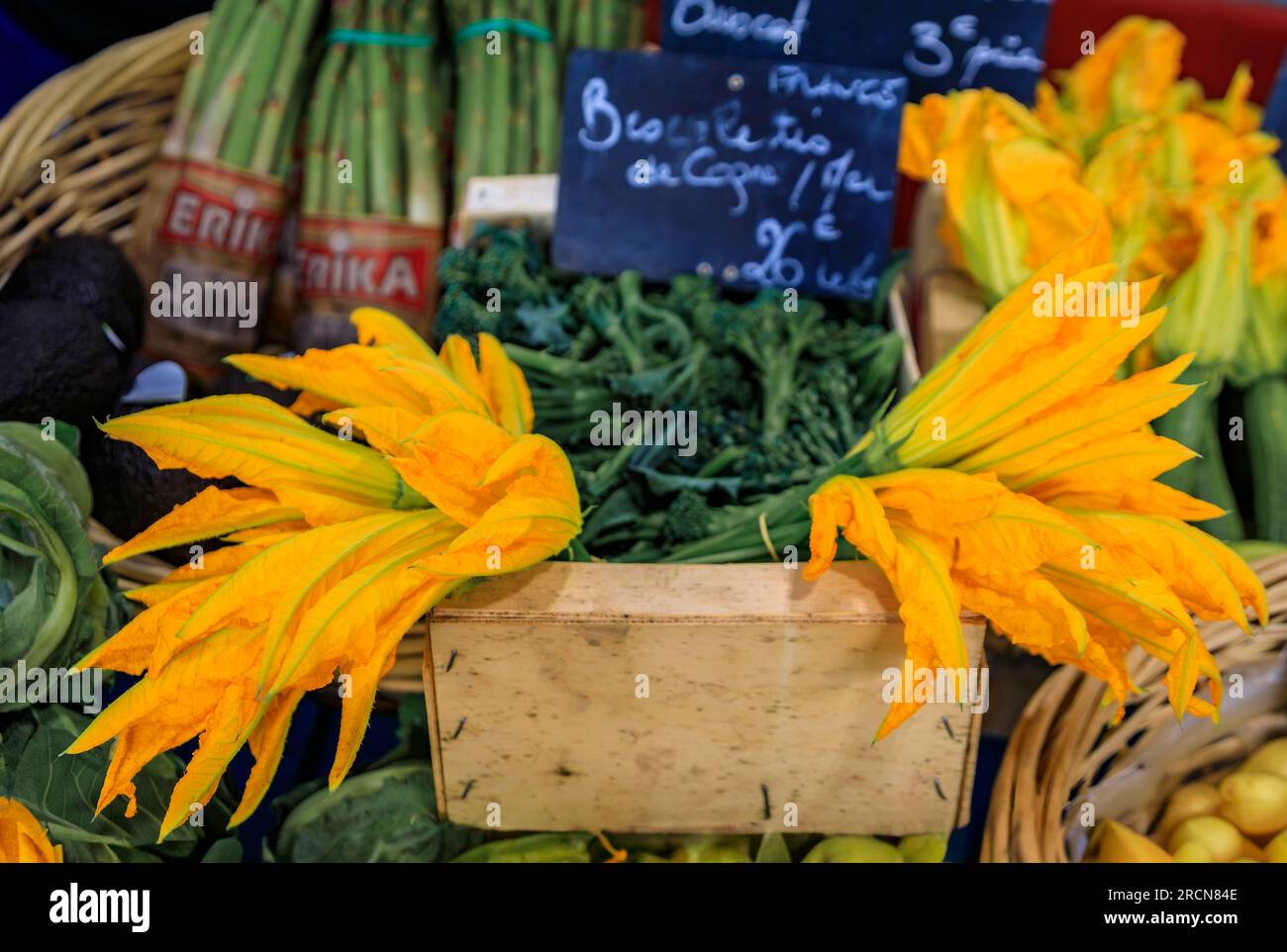 Traditional delicacy from South of France, courgette or zucchini flowers at a local provencal farmers market in Vieil Antibes, South of France Stock Photo