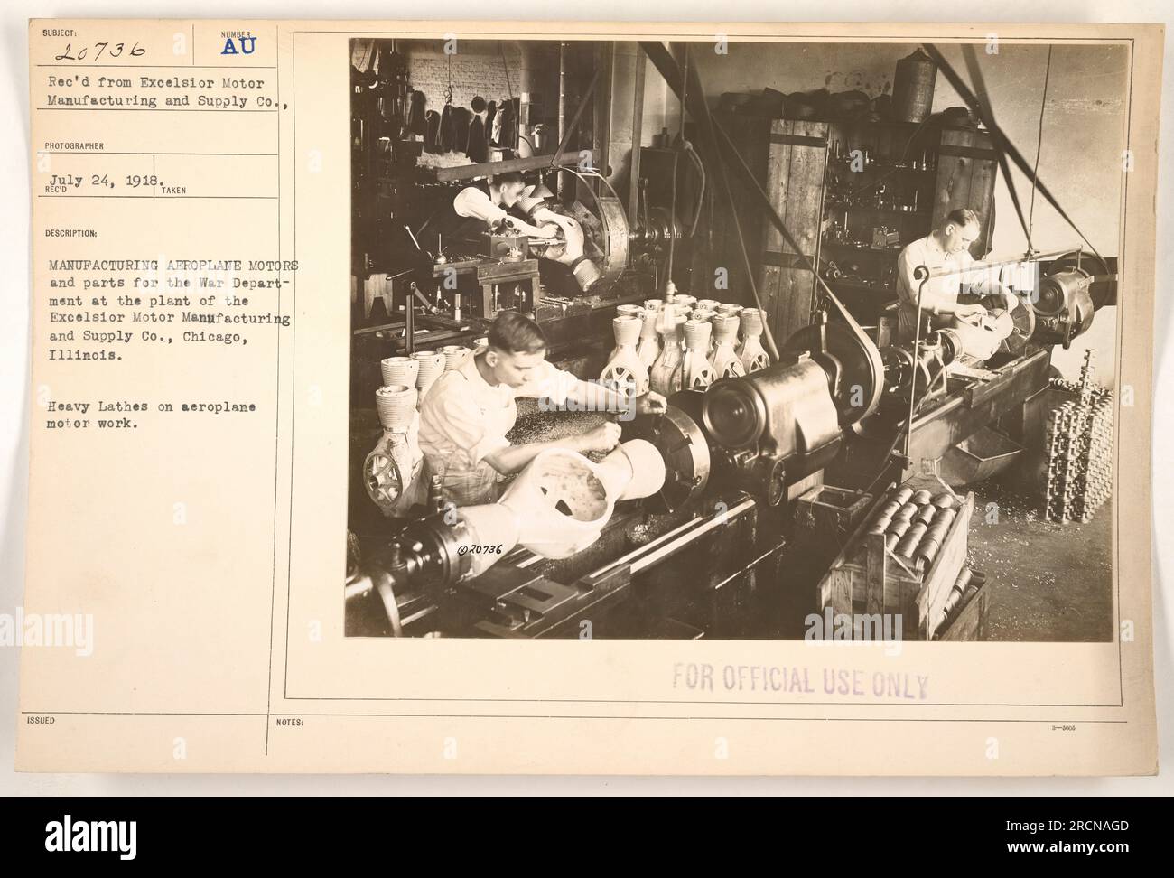 Workers at the Excelsior Motor Manufacturing and Supply Co. in Chicago, Illinois, manufacturing aeroplane motors and parts for the War Department during World War I. In the photograph, heavy lathes are used for the aeroplane motor work. This image is designated as 111-SC-20736 and was taken on July 24, 1918. Stock Photo