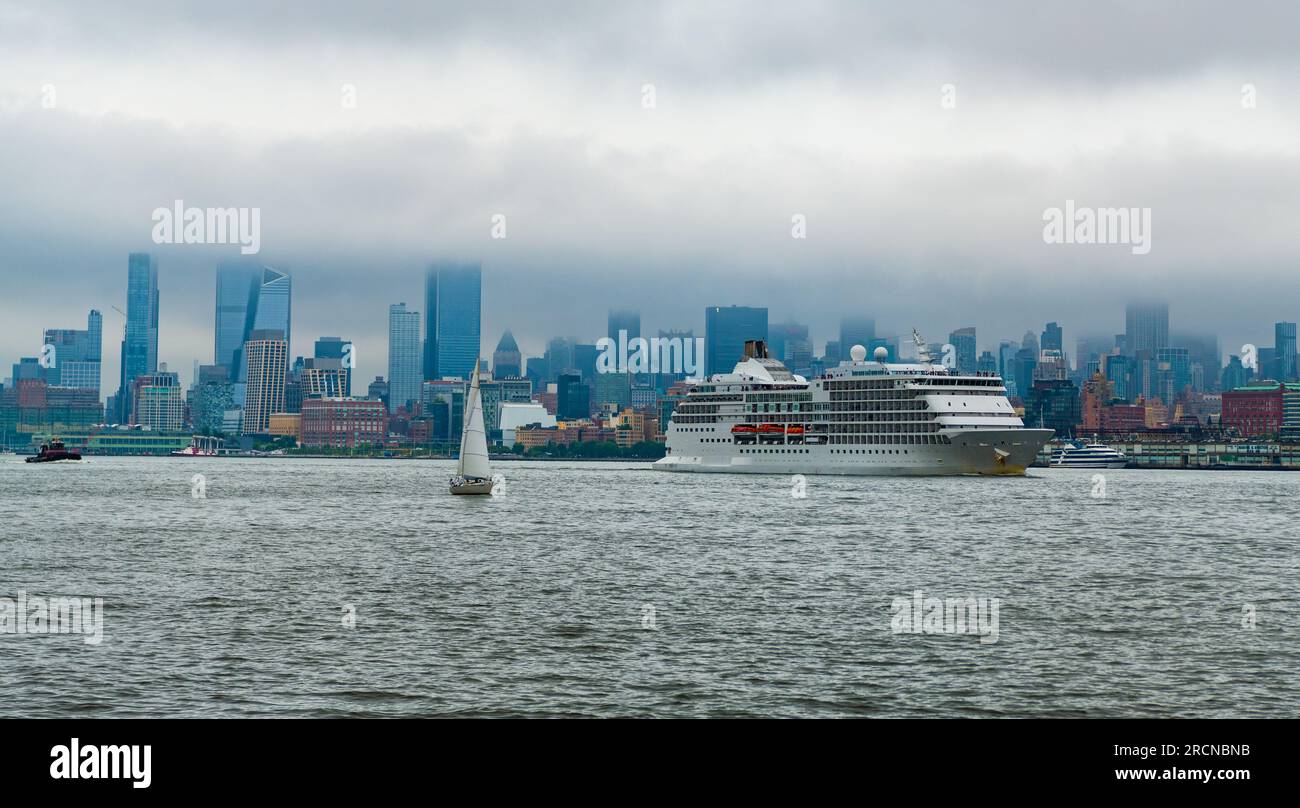 Cruise ship Regent Navigator sailing next Manhattan in New York. Skyline of New York Manhattan cruising on the Hudson River cruise liner . Vacation on Stock Photo