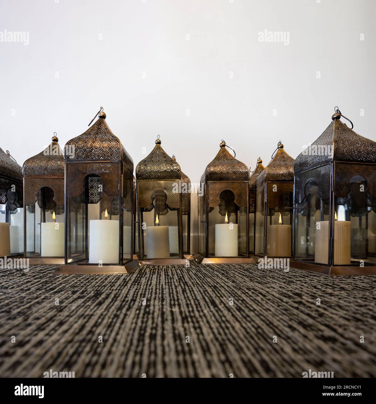 group of traditional arabic lanterns, candles with flames burning Stock