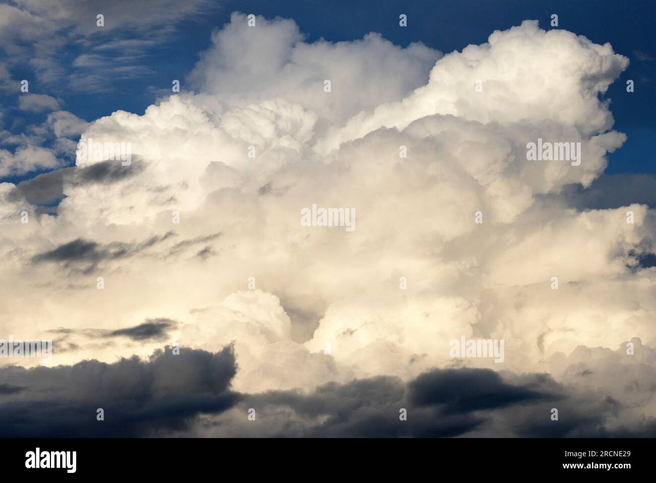 Each day as the heat build cumulus clouds develop and some form towering Cumulonimbus. These are capable of unleashing damaging storms . Stock Photo