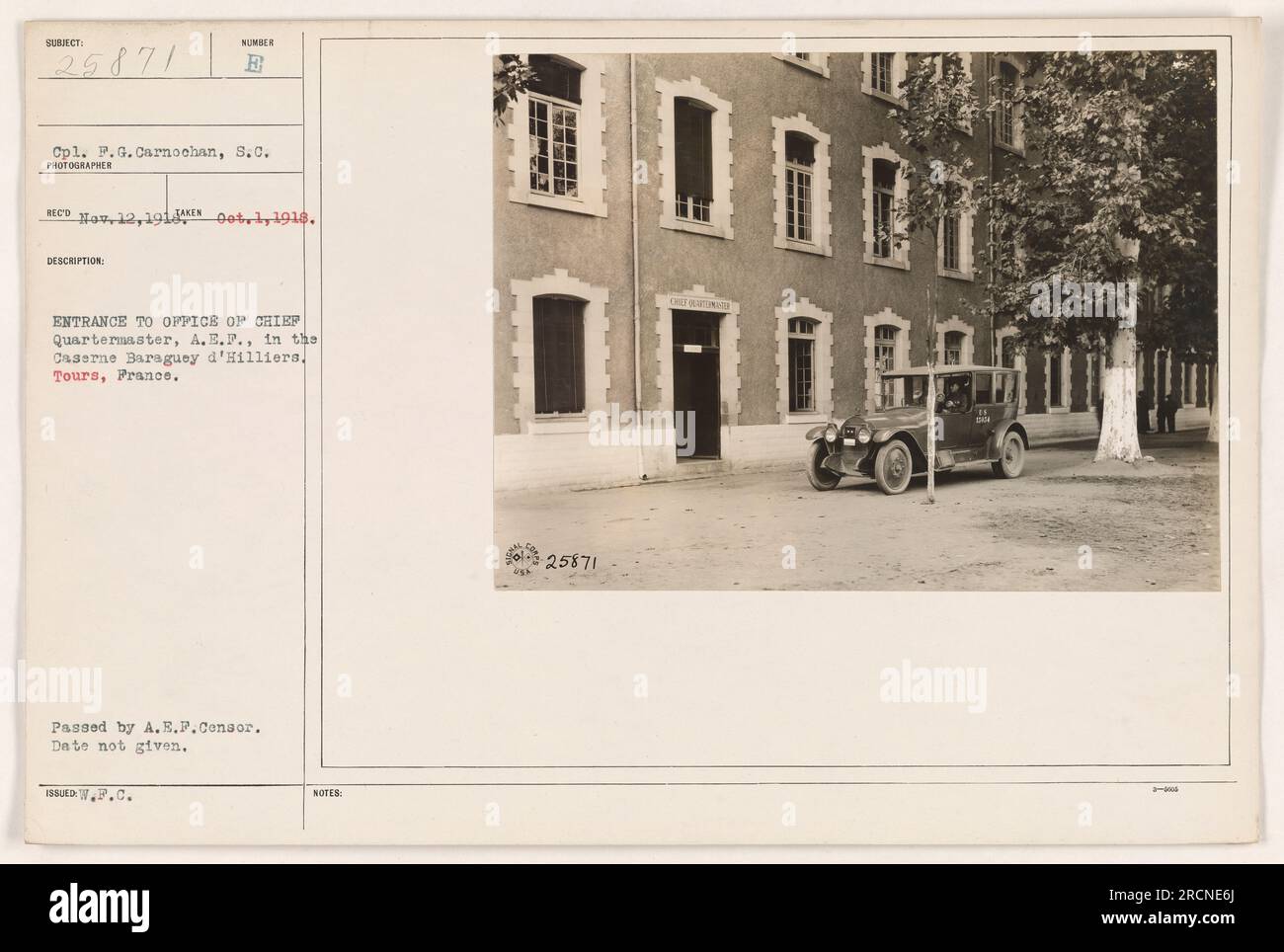 Cpl. P.G. Carnochan, S.C., is seen in front of the entrance to the office of the Chief Quartermaster, A.E.P., located in the Caserne Baraguey d'Hilliers in Tours, France. The photograph was taken on October 12, 1918. The image was approved by the A.E.P.Consor and does not indicate the exact date of issuance. The reference number for this photograph is 25871. Stock Photo