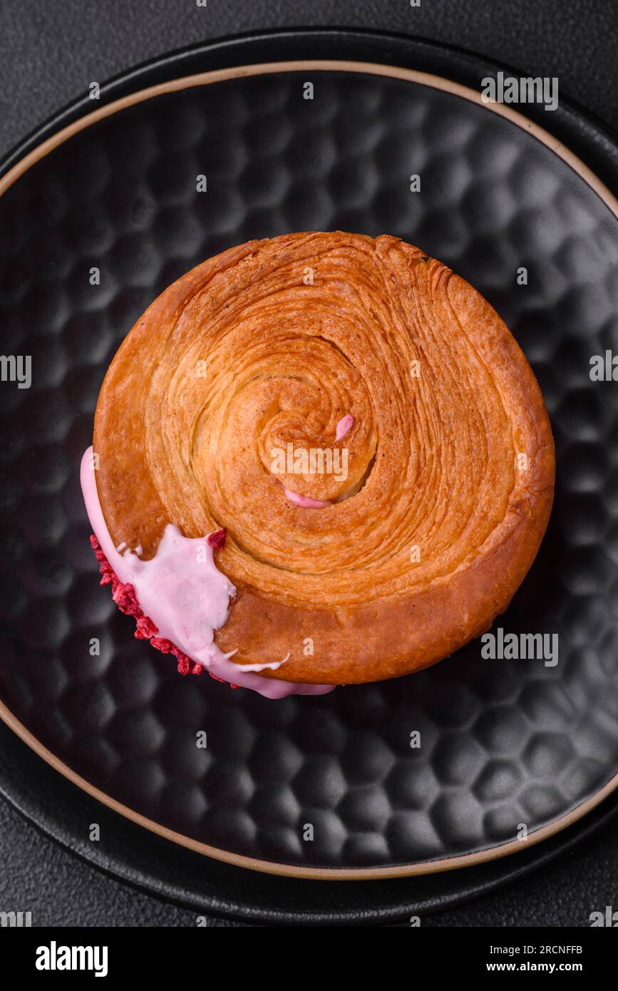 Round puff pastry croissant with raspberry filling or new york roll on ...