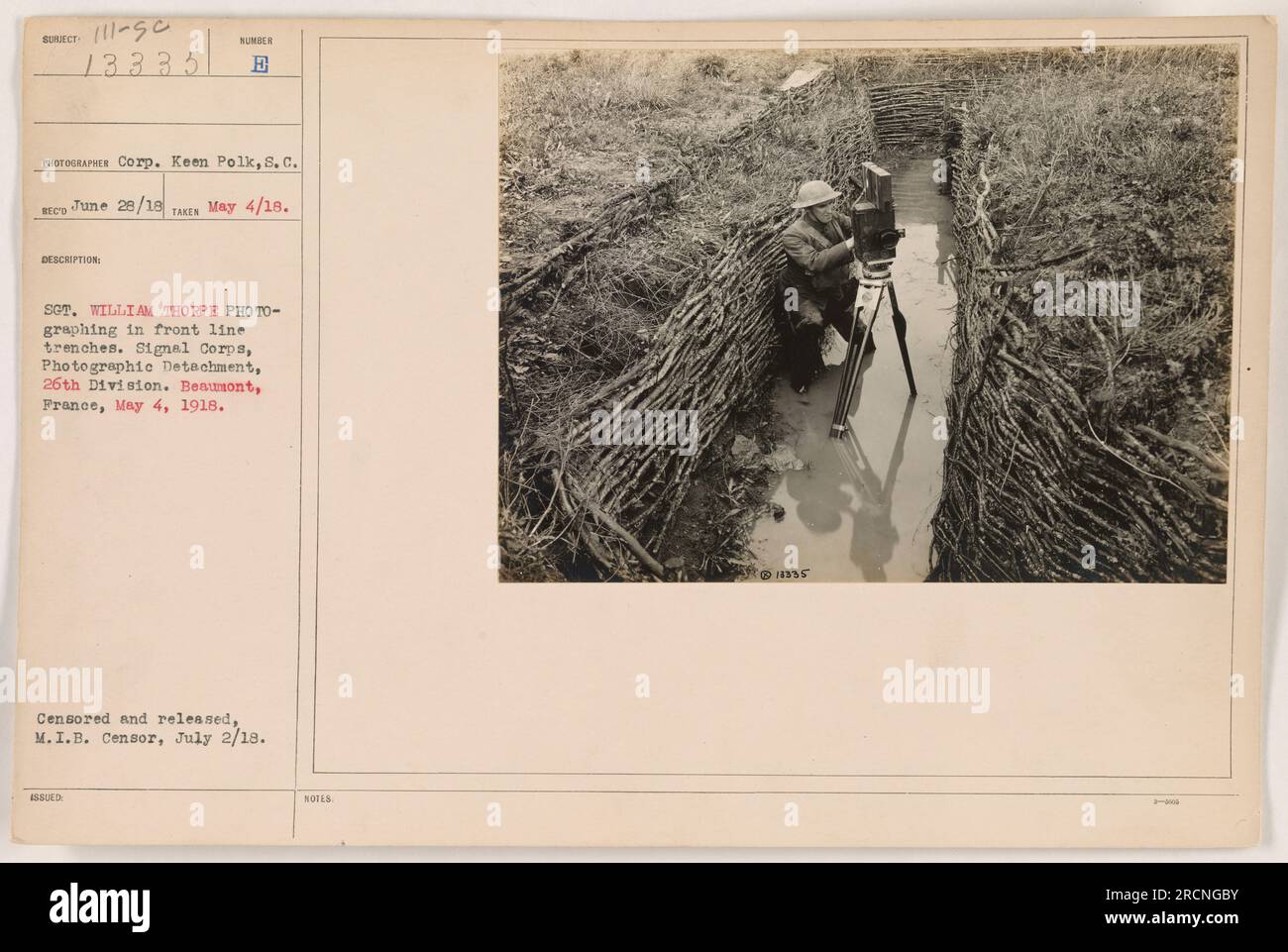Stg. William Thorpe, a photographer with the Signal Corps Photographic Detachment of the 26th Division, is shown photographing in front line trenches in Beaumont, France on May 4, 1918. This image is part of the Photographs of American Military Activities during World War One collection and was censored and released by the M.I.B. Censor on July 2, 1918. Stock Photo