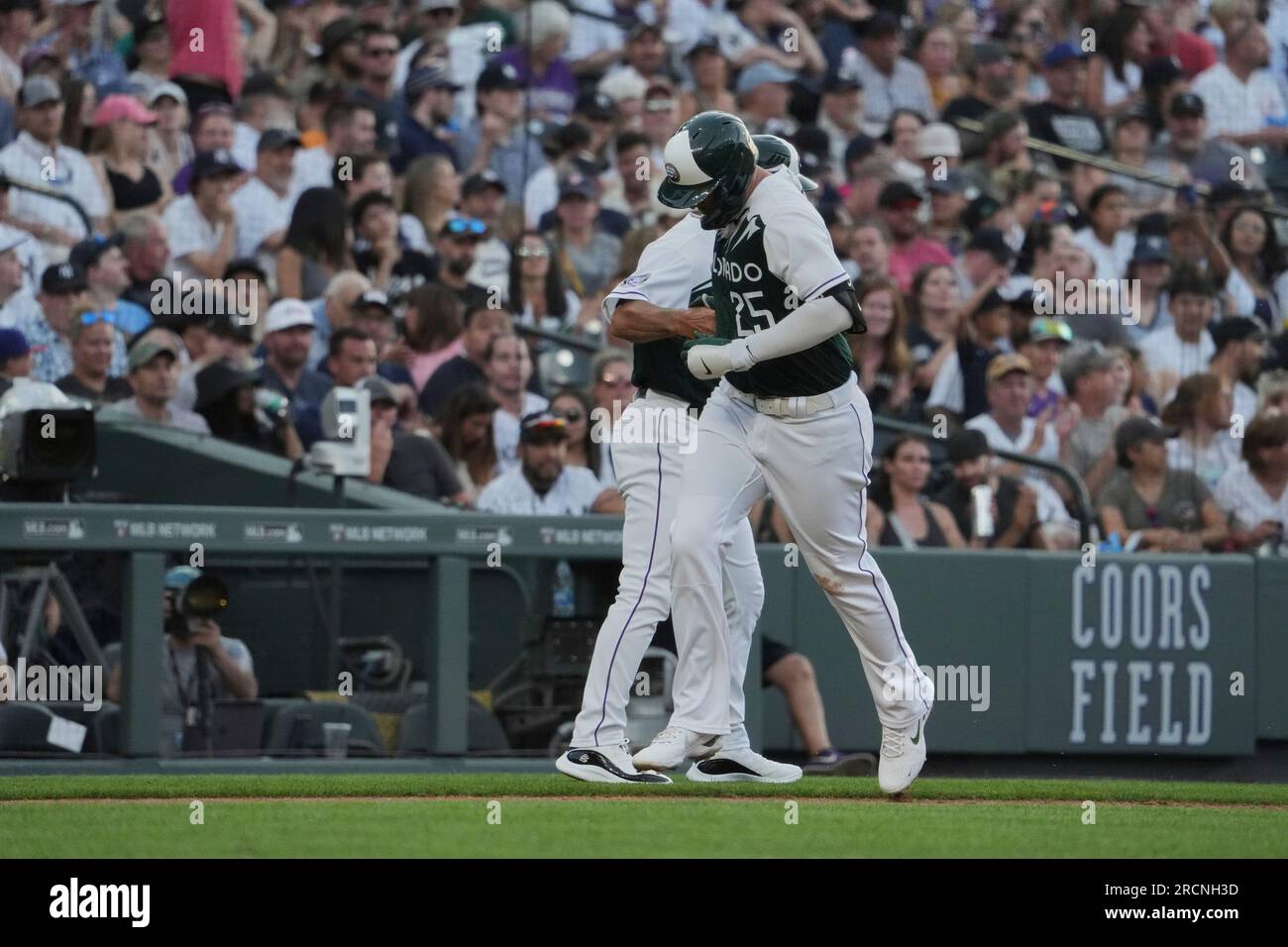 Denver CO, USA. 15th July, 2023. Colorado first baseman CJ Cron (25) hits a homer during the game with New York Yankees and Colorado Rockies held at Coors Field in Denver Co. David Seelig/Cal Sport Medi. Credit: csm/Alamy Live News Stock Photo