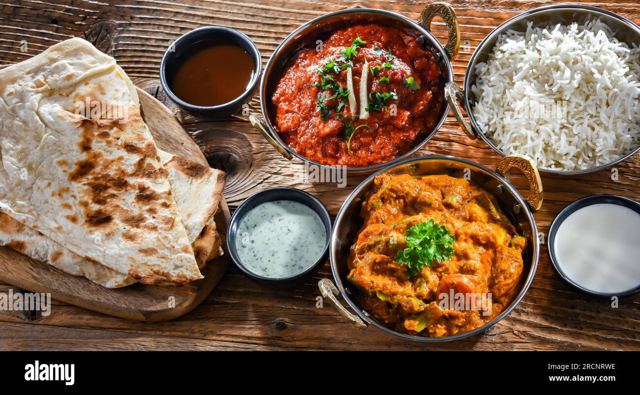 Hot madras paneer and vegetable masala with basmati rice served in