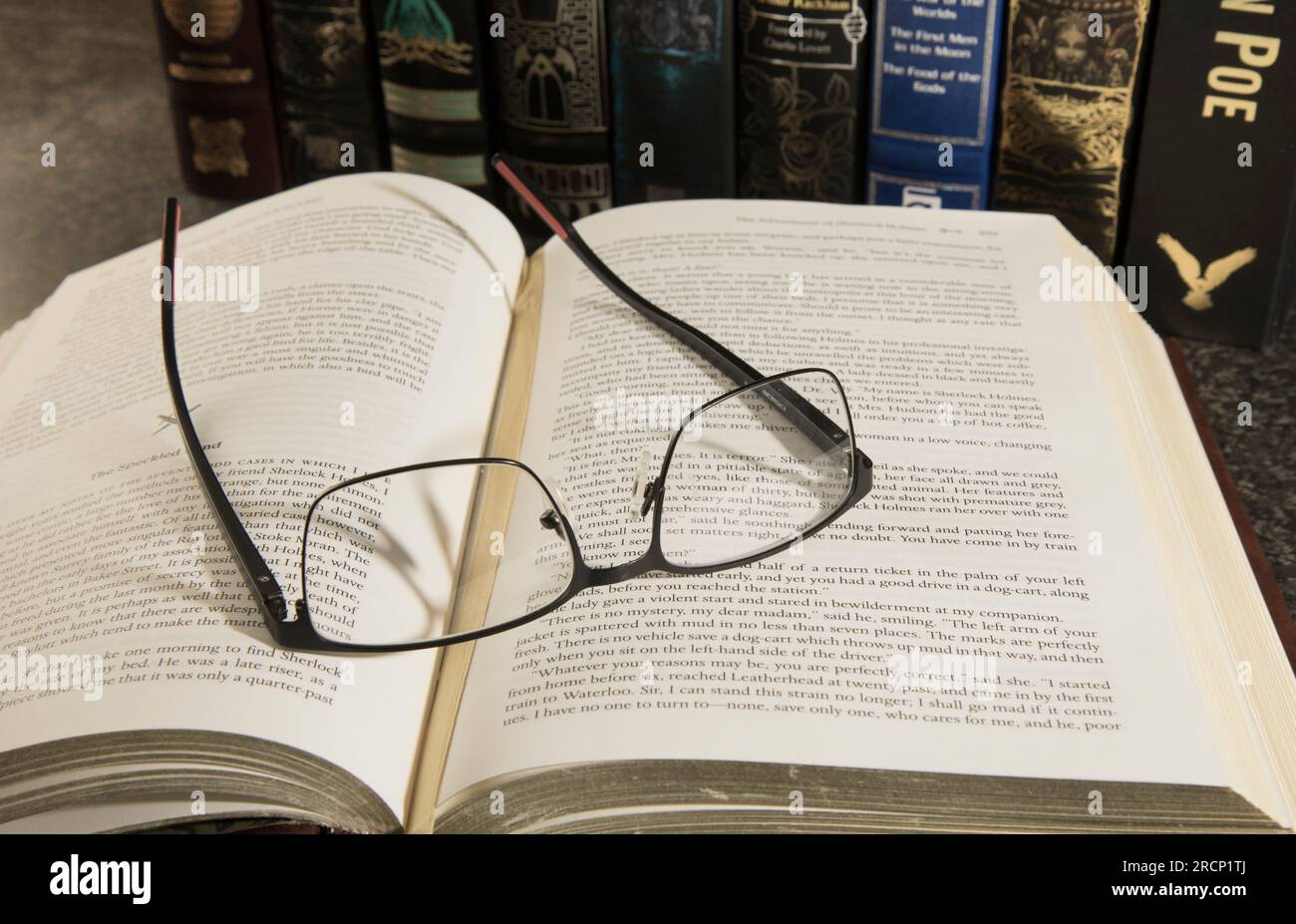 Classic Leather Books with Reading Glasses Stock Photo