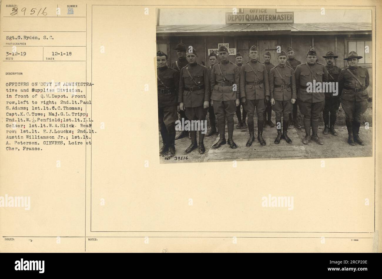 Officers from the Administrative and Supplies Division of the U.S. military are seen in front of the Q.M. Depot in Gievres, France. The photograph includes 2nd Lt. Paul S. Adams, 1st Lt. C.C. Thomas, Capt. K.C. Towe, Maj. G.L. Tripp, 2nd Lt. W. Penfield, 1st Lt. I.L. Gelser, 1st Lt. W.A. Slick, 1st Lt. E.J. Loucks, 2nd Lt. Austin Williamson Jr., and 1st Lt. A. Petersen. This photo was taken on March 12, 1919. Stock Photo