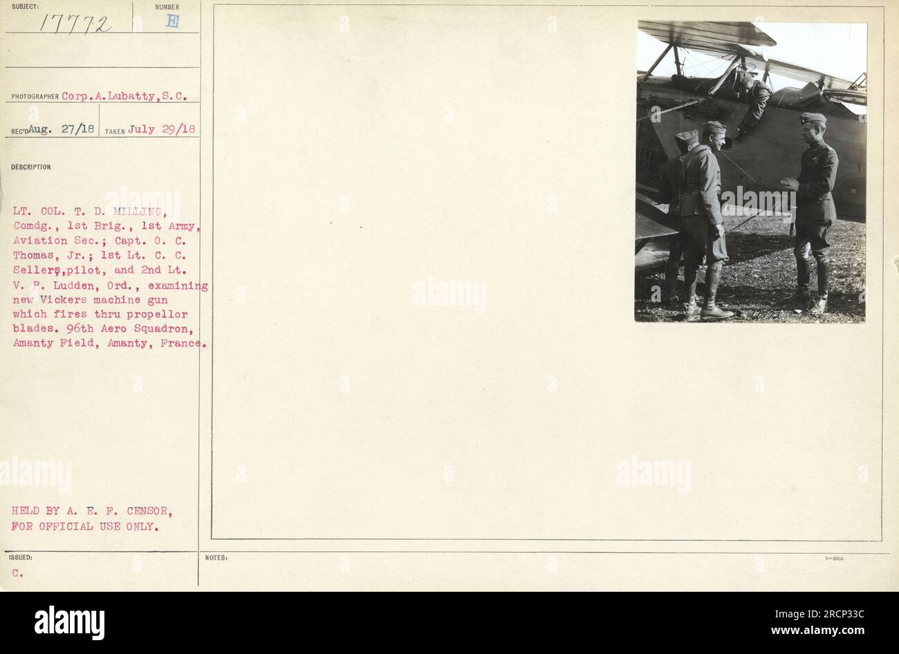 Lieutenant Colonel T.D. Milling, Captain O.C. Thomas Jr., First Lieutenant C.C. Sellers (pilot), and Second Lieutenant V.P. Ludden examine a new Vickers machine gun that is capable of firing through the propeller blades. This photo was taken on July 29, 1918, at Amanty Field, Amanty, France. This image is held by the A.E.F. censor for official use only. Stock Photo