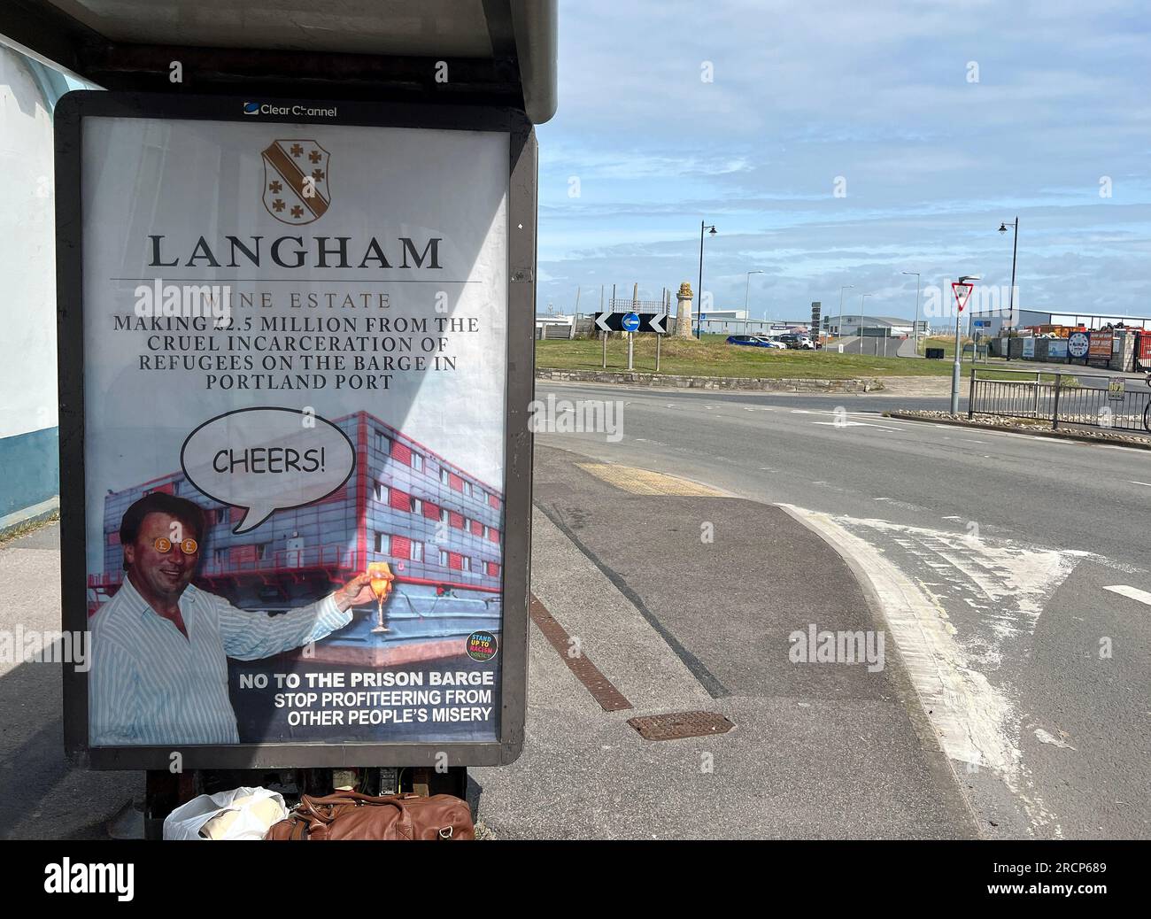 Portland, England, 16th July, An anti-immigration barge poster by political protest artist Bod is seen on a bus stop on Portland near to Portland Port where the Bibby Stockholm will be moored. Credit: Dorset Media Service/Alamy Live News Stock Photo