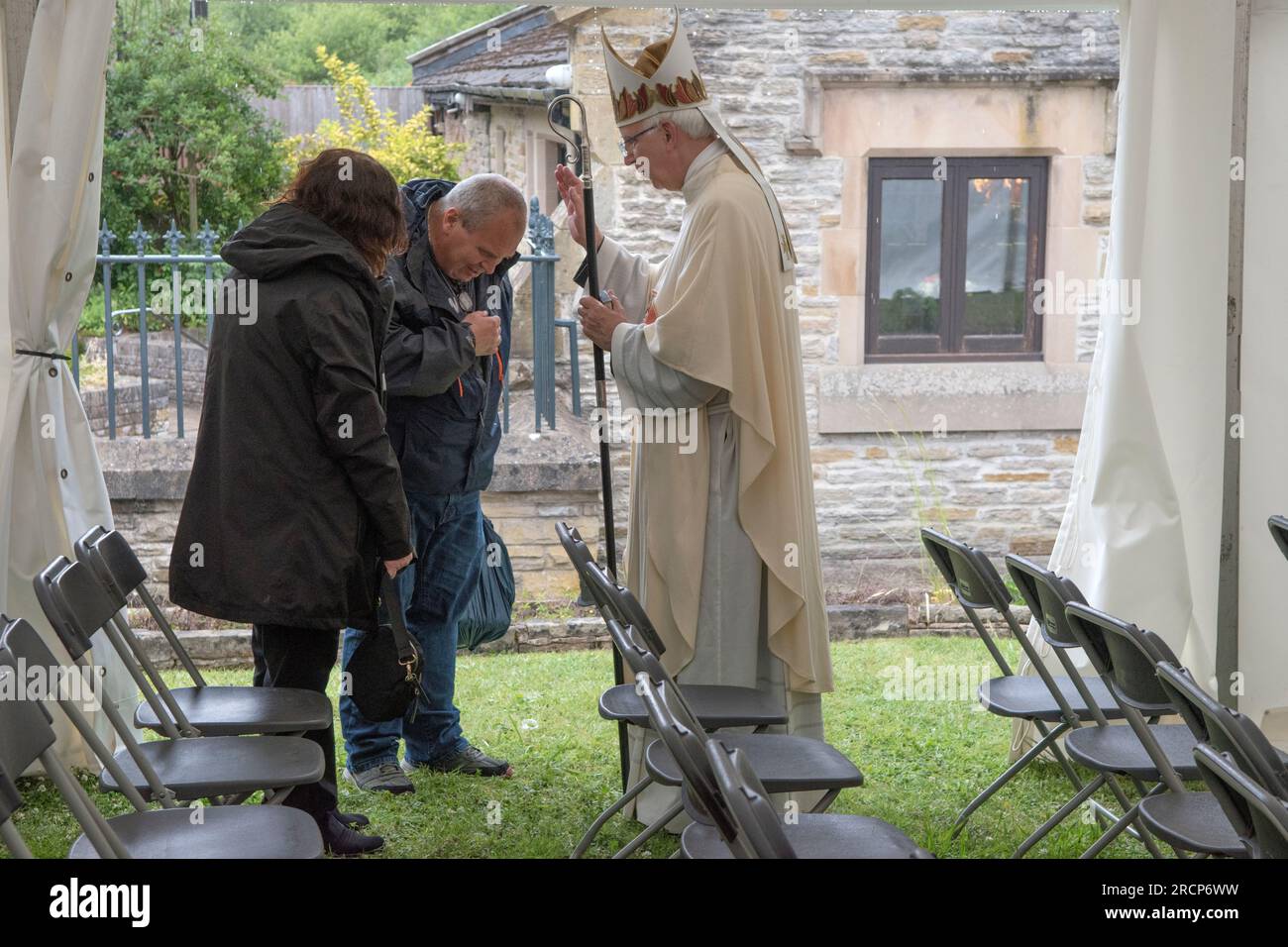 UK Catholic Bishop of Wrexham, the Right Reverend Peter M Brignall. He is blessing devout Catholics at Saint Winefride's Feast Day Pilgrimage, after an open air church service in a marquee. Holywell, Flintshire, Wales 25th June 2023. 2000s HOMER SYKES Stock Photo