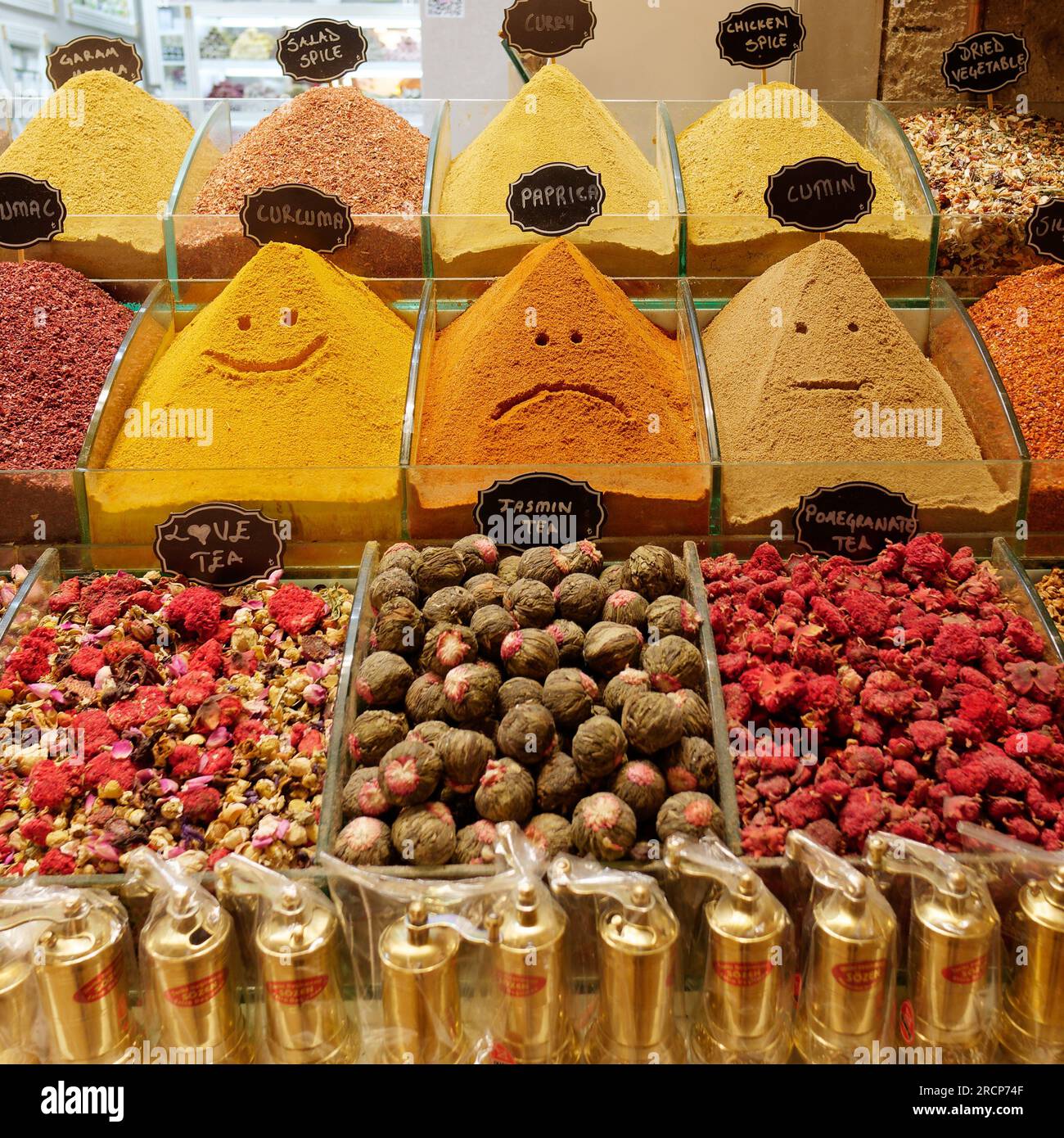 Novelty smiling and sad faces drawn in the spices in the Spice Bazaar (Mısır Çarşısı, meaning Egyptian Bazaar) in Istanbul, Turkey. Stock Photo