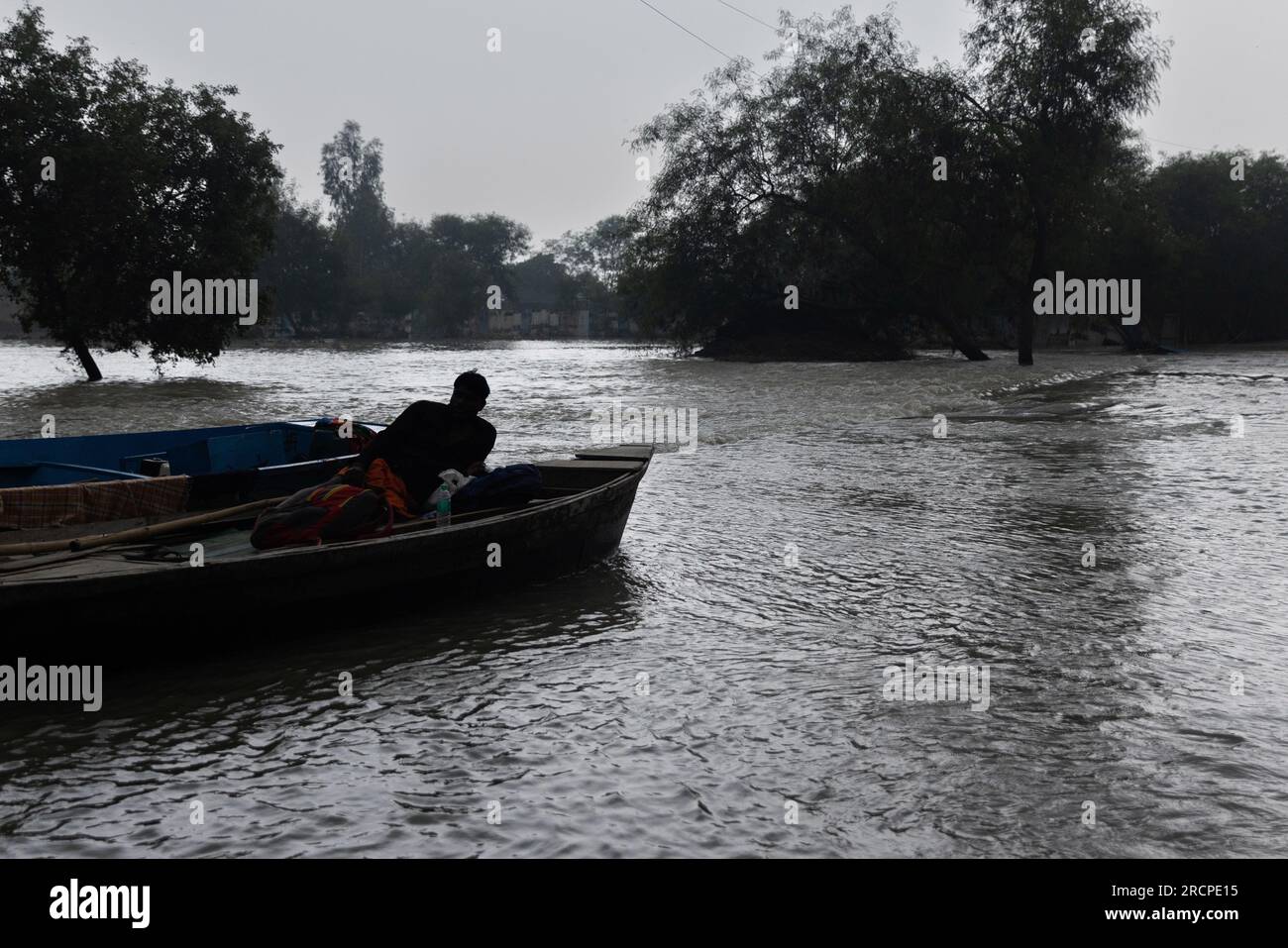 Noida, Florida, India. 15th July, 2023. A villagers waits for water to