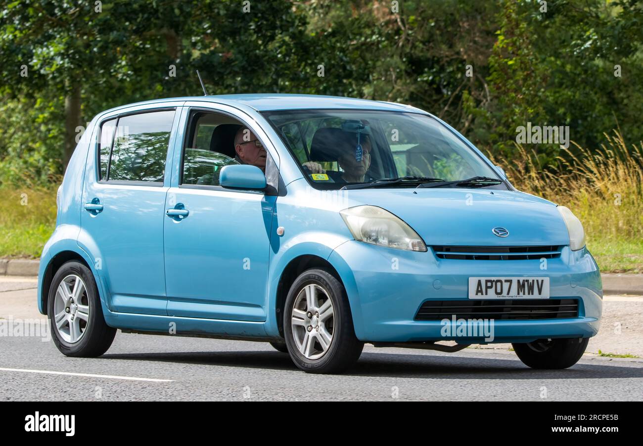 Milton Keynes, UK - July 16th 2023:  2007 blue DAIHATSU SIRION car driving on an English road Stock Photo
