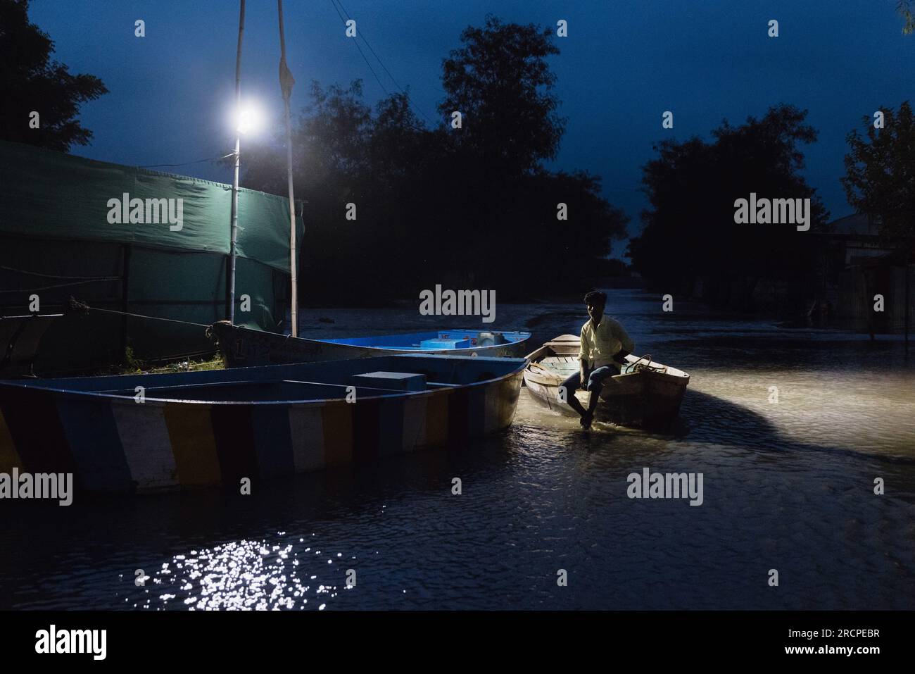 Noida, Florida, India. 15th July, 2023. A villagers waits for water to