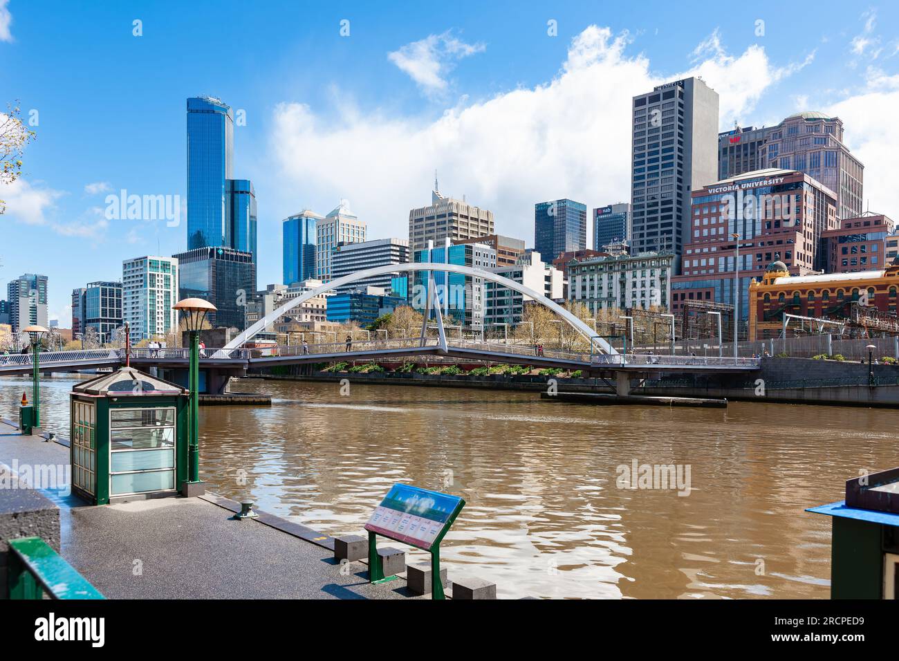 Melbourne, Australia - September 28, 2010 : Yarra River and Melbourne northbank. Southbank Pedestrian Bridge connecting north and south bank. Stock Photo